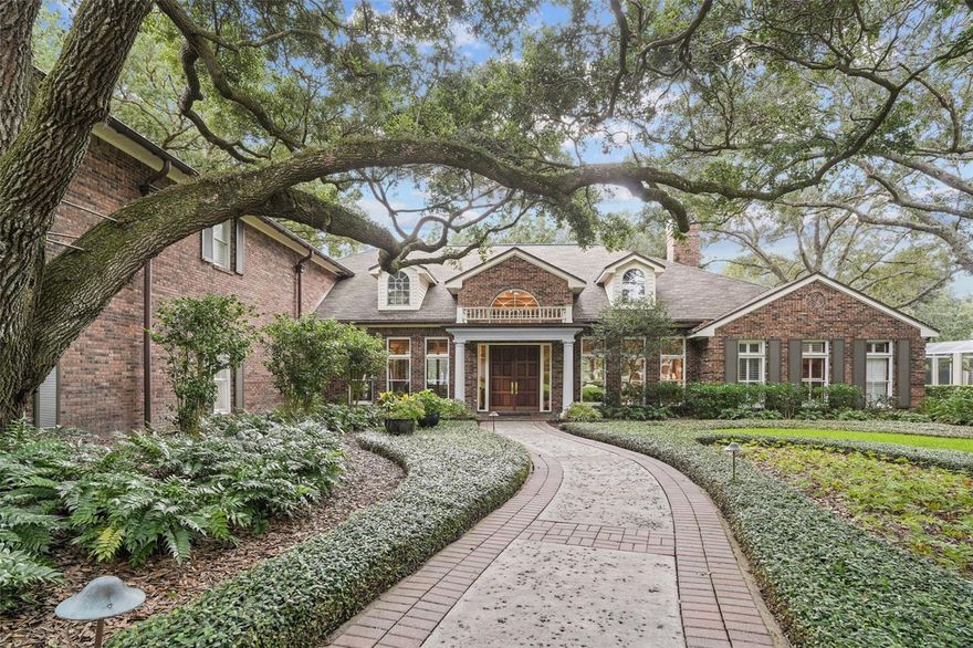 Nestled within Avila, Tampa Bay's most elite gated golf course community, stands a captivating luxury home epitomizing the pinnacle of elegance, tranquility, and design.
This 6,656 square foot, two-story marvel is gracefully positioned on a verdant landscape of over an acre, offering uninterrupted peace and serenity. Commanding stunning views of the tranquil pond, this grand estate features four bedrooms and four and a half bathrooms, each one a testament to impeccable craftsmanship and finishes.
Upon entry, the expansive foyer immediately captivates you with a soaring 15ft ceiling and the stunning vista of a serene pond takes center stage, drawing you into the opulence of the open-plan living spaces with the glass sliding doors. This mesmerizing view weaves its charm through all the rooms, tying together the home’s grandeur with nature's allure.
A formal living room invites with its intimate ambiance, complemented by wood flooring, plantation shutters, and exquisite crown molding. Adjacent, a cozy fireplace sitting area offers stone flooring, a wooden ceiling, and built-in bookshelves – an idyllic retreat for an evening read, with the serene backdrop of the pond through floor-to-ceiling windows.
The formal dining room, an epitome of elegance, offers stone floors and a wooden ceiling. Floor-to-ceiling windows frame the tranquil pond view, while glass doors on both ends enhance the feeling of space and allow for seamless transitions between indoor and outdoor entertaining.
Beyond these grand living spaces, discover a sophisticated sitting area or pub room, boasting warm wood flooring, crown molding, custom lighting, and an exposed brick wine cellar. This room's 11ft ceiling adds to the feeling of timeless elegance.
Further, the family room is a testament to thoughtful design. A grand glass wall with an arch overlooks the tranquil pond, bringing the outdoor beauty inside, while a custom wood ceiling and stone floor underscore the room's luxurious appeal.
The culinary center of the home, the kitchen, is nothing short of spectacular. Equipped with large island and state-of-the-art appliances that include two dishwashers, a gas cooktop, oven, and a SubZero fridge, it ensures cooking becomes a joyful experience. An adjoining dinette with glass doors opens to an outdoor patio, perfect for casual meals with a view.
The primary bedroom, with its arched doors, crown molding, and wood floors, offers a tranquil oasis for rest and relaxation. Its en-suite bathroom displays a stand-up glass shower and marble stone, further enhancing the luxurious appeal.
The study radiates sophistication with wood built-ins, custom woodwork on the ceiling, and an opulent gold chandelier. The property also includes a downstairs guest room, which doubles as a gym, an upstairs bonus room that's perfect as a home office or playroom, plus 2 additional en-suite bedrooms.
Avila's residents can enjoy 24/7 security, a beautiful park with a playground, soccer field, running path, basketball and pickle-ball courts, dog park, and pavilion. Also, you have the opportunity to become a member of the Avila Golf and Country Club, featuring a Jack Nicklaus-designed 18-hole golf course, tennis courts, pro-shops, fitness center, and pool pavilion.
Here, the allure of Avila’s prestige and the serenity of the pond view combine to create a timeless sanctuary that caters to a lifestyle of uncompromised elegance.