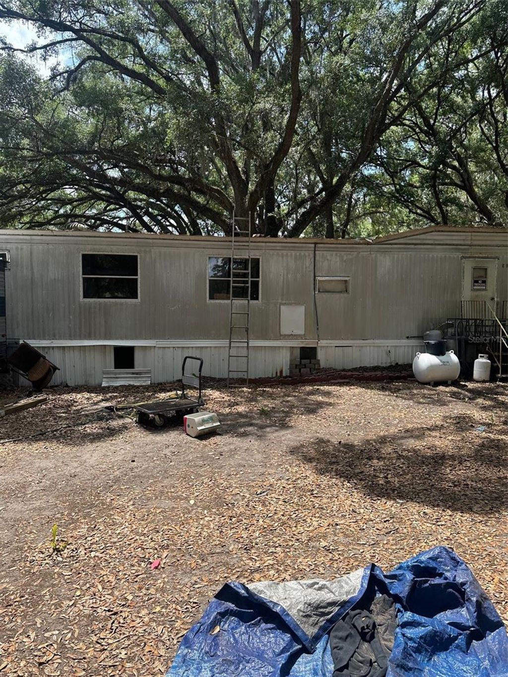 Photo of 9068 SE 12th Drive, Webster, FL 33597 (MLS # TB8504851)