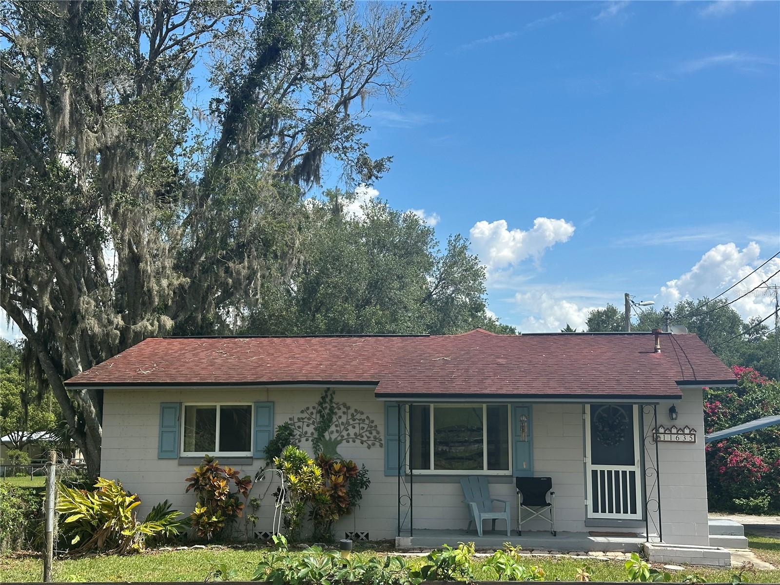 Due to no fault of the seller, the purchase fell through and home is back on the market. Rare find... Updated home with newer windows and the ability to use one part of the home as an inlaw suite situated on ONE ACRE with 4 separately fenced areas for your animal or gardening needs and a large 2 vehicle carport (22 ft wide by 19 ft long) with 2 sheds plus an enclosed lanai. This 1620 heated square foot home features 3 bedrooms and 2 bathrooms perfectly laid out over a split level floor plan. The lower level boasts a living room with a decorative fireplace, the master suite with a large closet encased in cedar and the master en-suite which includes dual sinks, a walk-in shower and a linen closet. Only 3 steps away is the open floor plan kitchen and 2nd living room. There are hardwood floors on this level with ceramic tile in the wet areas. The spacious eat-in kitchen features stainless steel appliances, beautiful granite countertops and white subway tile backsplash. Down the hallway are the 2nd and 3rd bedrooms both boasting cedar encased closets. The guest bathroom has a tub shower combination. You will have complete peace of mind buying this home since the HVAC is 2017, with a new motor installed in 2023, HWH is 2018, Roof is 2015 and the entire house newly insulation in 2017. The septic was pumped in 2024 and 2 new risers were added. The yard space has endless potential including farm animals, bonfire areas, space for boats, 4 wheelers, etc. This home is available for a quick close. Call today for a private showing.