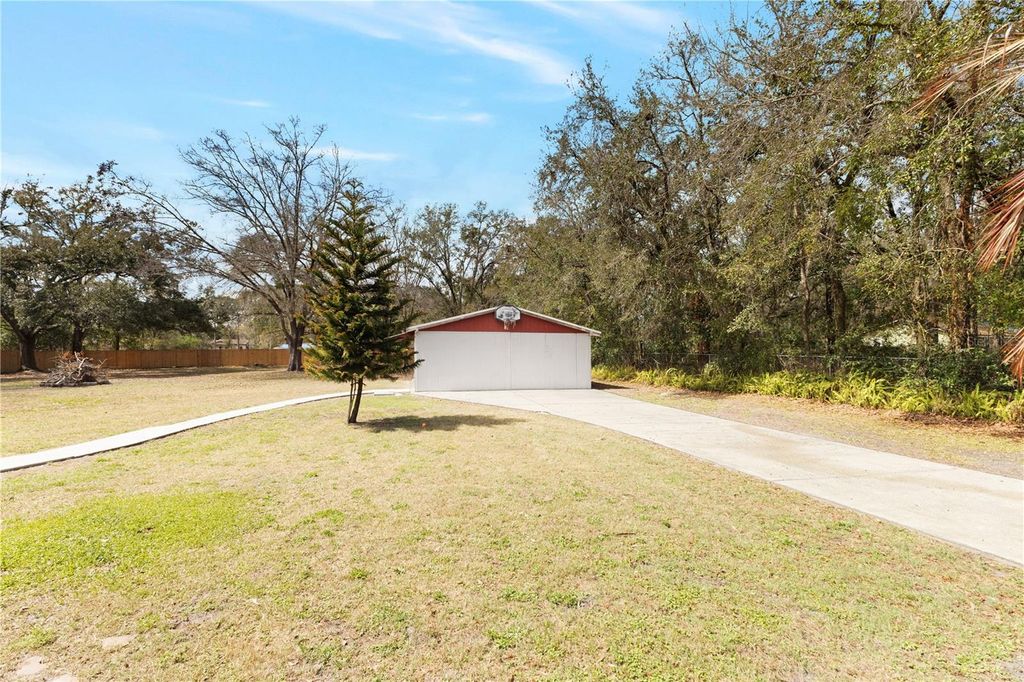 Photo of 6071 Country Club Road, Wesley Chapel, FL 33544 (MLS # TB8480485)