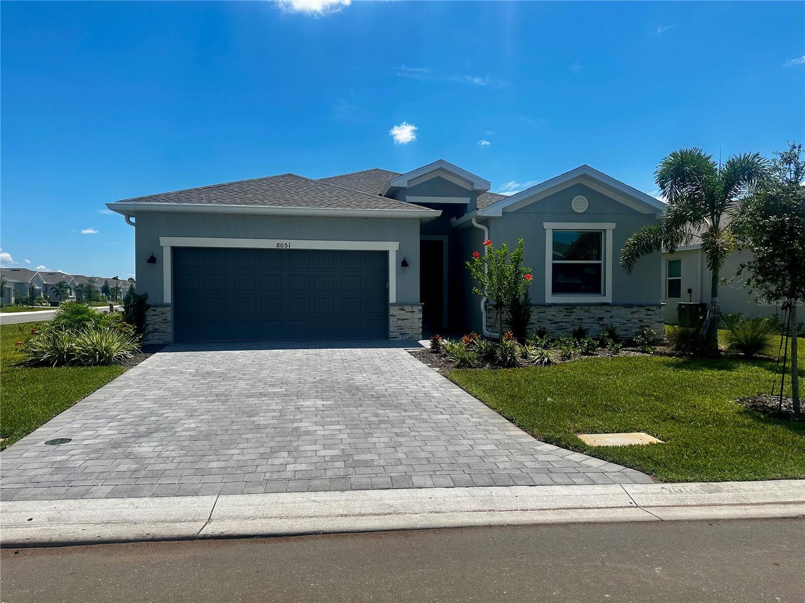 Beautifully designed single-story home in Island Lakes at Coco Bay, Englewood’s premier coastal community. Situated on an oversized corner lot with tranquil lake views, this home is in an X flood zone—NO flood insurance required—and features IMPACT windows for peace of mind. The open-concept floor plan connects the dining room, kitchen, and family room, perfect for entertaining. Enjoy Florida living from the covered lanai overlooking the water. The split-bedroom layout includes a luxurious owner’s suite with a spa-like bath and large walk-in closet.
HOA includes: yard maintenance, high-speed internet, community pool, clubhouse, pickleball, fitness center and playground. Additional highlights: 4 bedrooms, 3 baths, versatile two-car garage. Island Lakes offers resort-style amenities in a master-planned setting.