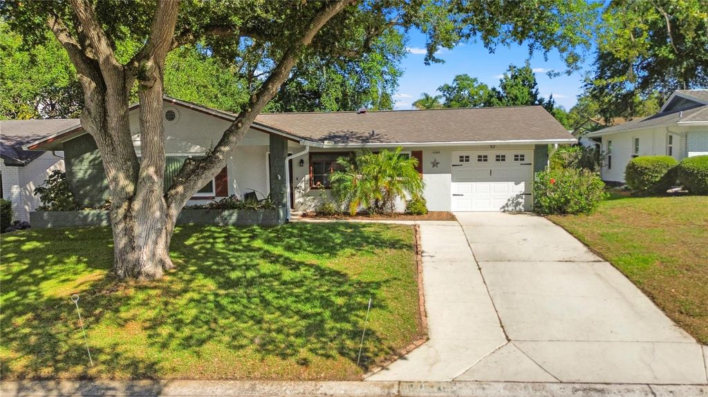 Photo of 10616 Springwood Drive, Port Richey, FL 34668 (MLS # TB8497180)