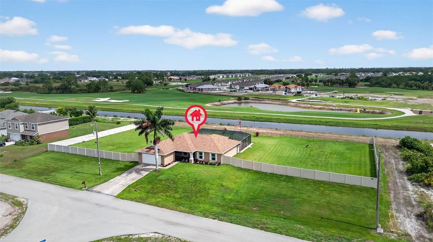 Recent price adjustment—seller is motivated, the property is fully turnkey, and ready for immediate enjoyment. This beautifully maintained 3-bedroom, 2-bath pool home sits on a full 1-acre lot with peaceful canal and golf course views. Offering 1,666 sq ft of thoughtfully designed living space, this property is ideal as a primary residence, seasonal getaway, or high-performing rental. Inside, you'll find a bright, open floor plan with vaulted ceilings, a flexible den/office space, and a well-appointed kitchen featuring stainless steel appliances, ample cabinetry, and a breakfast bar, washer and dryer and a upright/chest freezer. Step outside to your private outdoor oasis, featuring a 25’ x 19’ chlorine pool with waterfall, a 9’ x 9’ spa, with dual outside motorized drop down 40" smart tv's on a sprawling 54’ x 39’ paver deck with solid 4” concrete underlay, multiple function led lights for any season, flood lights for security and motion lights on side lots. The pool and spa are fully integrated with a WiFi-enabled control system, allowing scheduling and remote access via smartphone or internet. Complete 10 zone irrigation system, 5-camera 1080-I night vision security system and doorbell camera and two motion-activated digital cameras north and south with cloud storage.  New roof (2023), HVAC system (2020), Water heater (2019), Storm Smart Cat 5 hurricane-impact windows and Kevlar rear lanai storm curtains (2023), Fresh interior and exterior paint, Updated carpeting throughout, Chamberlain garage door opener, New 6-ft vinyl privacy fence, installed 18 inches above grade for airflow and visibility without sacrificing privacy. The triple-sized, fully fenced backyard offers unmatched space for entertaining, gardening, pets, storage of equipment, cars, boats, campers or additional home/s or storage building or shop. Future expansion possible as lots can be split after you purchase them for in-laws or extended family homes or for resale cash value, all framed by scenic golf course and canal views. Built with concrete block construction, stucco exterior, shingle roof, and an attached 2-car garage, this home offers both durability and style. Located close to shopping, dining, schools, and major roadways, it delivers the perfect blend of peaceful living and convenient access. No assessments and no flood insurance required, helping keep ownership costs lower—an advantage not found in certain nearby cities where taxes and assessments continue to rise. If buyer prefers Turnkey, it is available. House would be fully furnished (as presented at bid acceptance), including a King Sleep Number bed and a Queen Tempur-Pedic bed with adjustable base, full house generator system, upright freezer, two new lawn mowers (42" riding lawn mower with mulching kit and 21" self-propelled mower with mulching or bagging), automated pool vacuum, dishes pot n pans silverware, art and wall decor interior and exterior making this a truly turnkey opportunity for move-in ready—schedule your private showing today! if only interested in certain turnkey items specify with your bid.