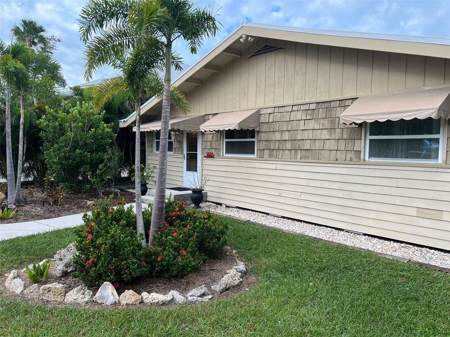 This charming 2 bedroom, 2 bath, open concept Florida Bungalow is situated on the Intracoastal. The waterfront location offers breathtaking views of the Intracoastal Waterway and Endless Sunset Lemon Bay Views.  Imagine waking up to the tranquil sound of the water and its truly a rare find.  Enjoy your morning coffee while watching boats go by.   With its prime location, your guests will have easy access to water activities, fishing, and beach relaxation.  The proximity to the water adds a touch of tranquility and serenity to the overall vacation experience.

One of the standout features of this property is the dockage with a convenient jet ski lift.  Your guests will have the incredible opportunity to dock their watercraft right at their doorstep, making it effortless to explore the waters and enjoy various water sports.  Whether it's a leisurely boat ride or thrilling jet ski adventure, this added amenity elevates the overall experience and provides endless possibilities for entertainment.

This property also offers a unique feature where the garage has been transformed into a personal fitness room.  This space is fully equipped with exercise equipment, providing ample room for workouts and promoting a healthy lifestyle.  You will have the convenience of staying active without even leaving the house, ensuring your overall well-being is prioritized during your stay.    Come see what Florida Living is all about.