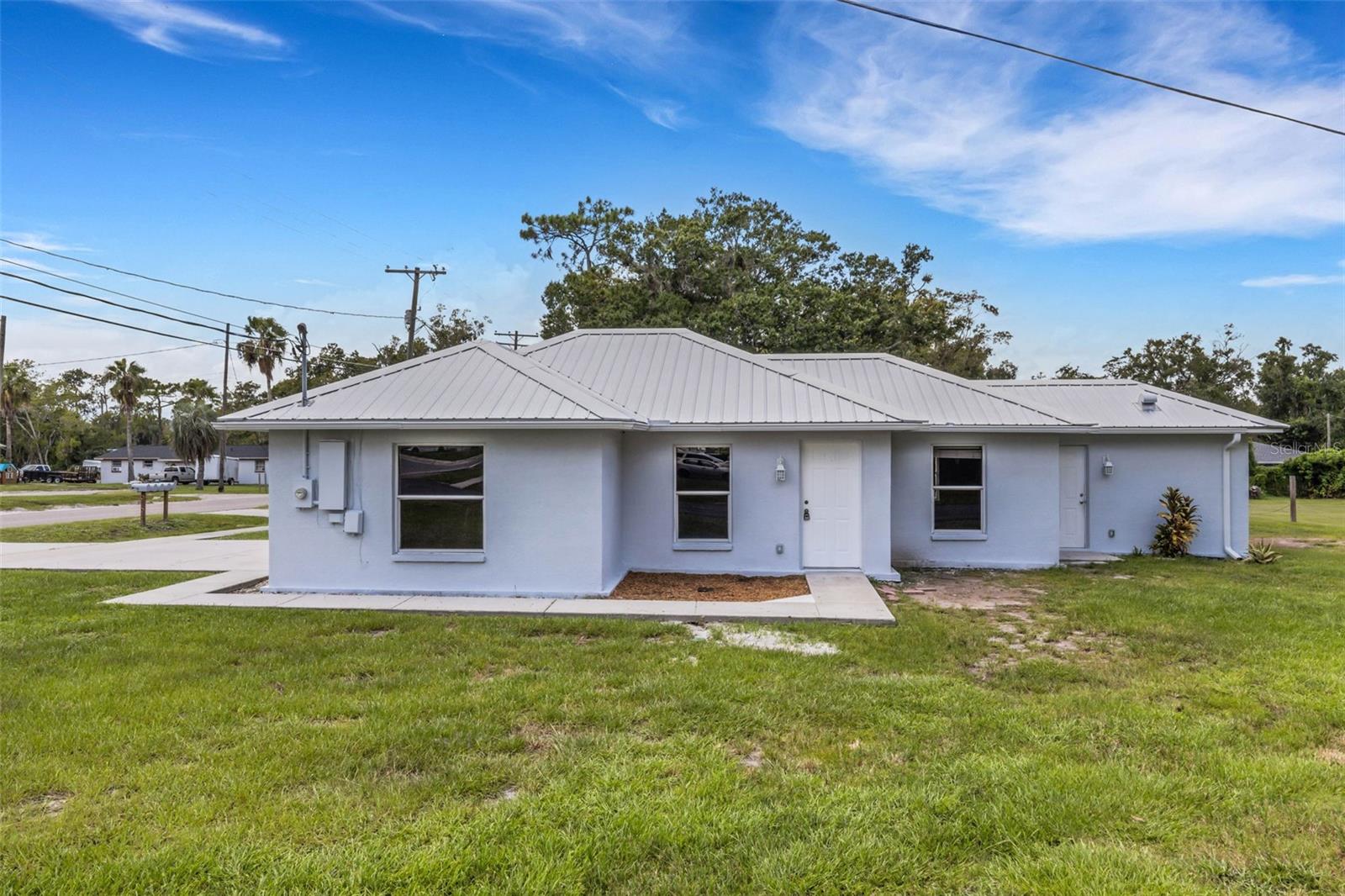 Ready and waiting for new owners. This 3 bedroom home features a metal roof, all new flooring and paint. Large living room and dining room. Located just west of the Strawberry Festival grounds and across from City Park.