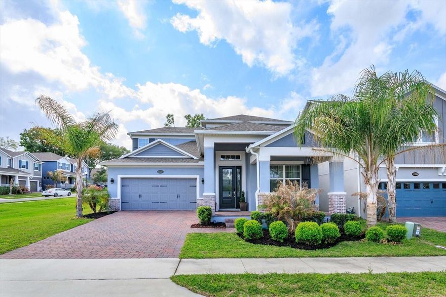 Nestled in the serene, lakefront community of Hull Island, this meticulously maintained corner-lot home offers 4 bedrooms, 4.5 bathrooms, and a spacious bonus/game room. The Dorchester floor plan delivers a modern layout designed for both comfort and functionality.  Upon entering the elegant foyer, you are welcomed by a formal dining room or flex space that leads into a bright, open-concept living area. The upgraded gourmet kitchen is a standout, featuring stainless steel GE Profile appliances, a gas range, quartz countertops, ceiling-height cabinetry, and a stunning oversized waterfall island with seating that overlooks the breakfast nook and family room.  Perfect for entertaining, the main living space is filled with natural light from three large sliding doors that open to a covered lanai and private backyard, complete with a full outdoor bathroom. The first-floor primary suite serves as a relaxing retreat, offering a spa-like bathroom with dual vanities, a spacious shower, garden tub, and a generous walk-in closet. Upstairs, you will find three additional bedrooms and two bathrooms, including a secondary bedroom with a private en-suite, ideal for guests or multi-generational living. The expansive bonus/game room provides a versatile space for a home theater, gym, playroom, or lounge.  This home is thoughtfully enhanced with wood-look tile flooring throughout the first floor, upgraded designer lighting, modern ceiling fans, decorator finishes, and abundant storage. Enjoy an elevated audio experience with integrated surround sound in the living room, lanai, primary suite, and upstairs bonus room, featuring built-in in-ceiling speakers for immersive TV and music throughout.  Smart home features include Ecobee thermostats, a Ring doorbell, and a garage EV charger. Additional upgrades include 8-foot raised panel doors, a tankless gas water heater, an interior laundry room with utility sink and gas washer and dryer hookup, outdoor kitchen and pool prewiring, and a whole-house water softener.  Residents of Hull Island enjoy resort-style amenities, including a pool and clubhouse, playground, dog park, dock, and fishing pier. Ideally located near the West Orange Trail, historic downtown Winter Garden, and Clermont’s lakefront dining, this home offers convenient access to shopping, dining, weekly farmers markets, major roadways, and Central Florida attractions.  This is more than a home, it is a private retreat offering comfort, style, and an exceptional location.