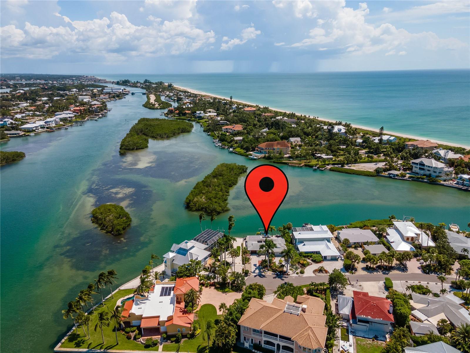 Casey Key is an amazing place to live, especially with views like this. This home is unfurnished and is now available as an annual rental. Sorry, no short term leases. New dock being installed with new 20,000lb lift, 16' between pilings and 14.6' beam. Minimum size boat it can handle is a 42'+ depending on type. This home is sitting on the Intracoastal waterway, aka Blackburn Bay with stunning views of the wide water way to your east & south while being in a protected cove with a minimal wake zone, watch dolphins and manatees playing as you relax by the pool or sit on the deck. This home is located just off the busier Casey Key Rd at the end of a cove, hence the name Casey Cove Rd. It is also at the end of the street just beside the point house at the end of a cul-de-sac. Other then your immediate neighbors there is no traffic and has the best possible views outside a point view. Very quiet and peaceful. Ride your bike or take a stroll in this small enclave and avoid the traffic worries as you ride. I just can't say enough how peaceful the neighborhood really is. The depth at low tide just off the seawall but before the center of the boat lift was 4'3" and High tide appears to run around 6' or so. Plenty deep for that sailboat or large power boat. You have 75' of seawall on the water way. There is a heated pool with spa in the rear of the home to relax in while enjoying these amazing water views with boats going by and birds flying above. Significant number of dolphins and manatees in this immediate area. The island across the way has all types of birds like Seagulls, Herons of all types, Osprey and brown Pelicans hanging out in the trees and occasionally the green Parrots who have adopted this area of FL for their home. All front windows are Hurricane windows as is the new beautiful front entry door. Schedule an appointment to view this excellent location in a laid back neighborhood on Beautiful Casey Key. Nokomis public beach is less then a mile away. House will be available for showings starting on June 15th 2025. Home is now unfurnished.