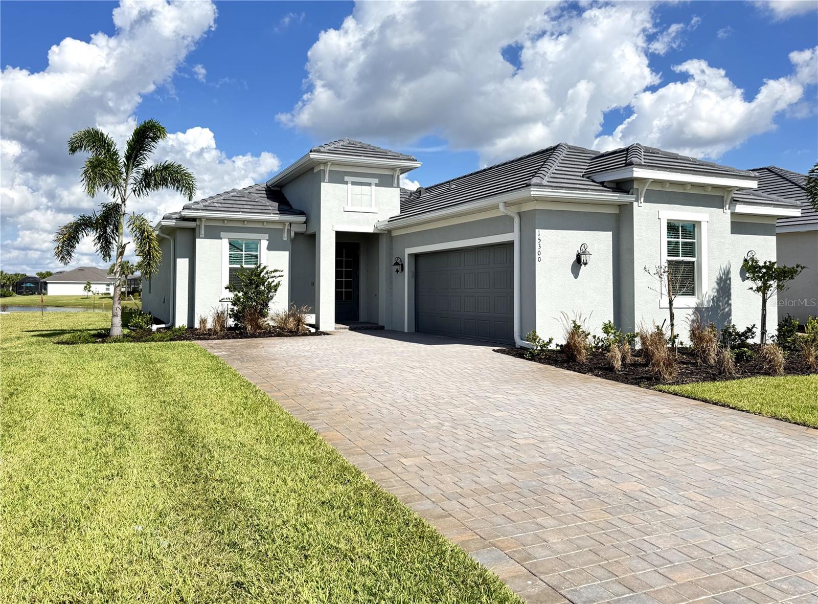 Welcome to 15300 River Birch Ct, Punta Gorda, FL — a stunning Victoria model home that perfectly blends elegance, functionality, and Florida lifestyle flair!Step inside this 2-bedroom + den, 2.5-bath home and fall in love with its open, airy design and thoughtful details throughout. With 1,850 sq. ft. of living space plus a spacious 365 sq. ft. lanai, this home is designed for effortless entertaining and everyday comfort.The gourmet kitchen will delight any chef — featuring stainless steel appliances, granite countertops, WiFi smart oven, soft-close cabinetry, and a tray ceiling for a touch of sophistication. The dining area, just off the kitchen, also boasts a tray ceiling, creating an inviting space for memorable meals.The great room is open and bright, ideal for gatherings or cozy evenings, while the private den with elegant glass double doors is perfect for a home office or hobby space.Retreat to the luxurious primary suite with a walk-in closet, second closet, private lanai access, and a spa-like bath featuring dual sinks, a soaking tub, and a doorless walk-in shower.Guests will appreciate the privacy of the second bedroom and adjacent full bath located at the front of the home. A convenient half bath off the lanai adds an extra layer of ease when entertaining outdoors.Enjoy peaceful mornings or sunset evenings on the 33’ x 10’ screened lanai, overlooking a beautiful lake view, complete with multiple outlets for TVs and accessories — perfect for outdoor living and entertaining.The epoxy-finished 2-car courtyard garage adds curb appeal and function, while the laundry room comes fully equipped with a washer and dryer for your convenience.Located in the Heritage Landing Golf & Country Club, this home offers access to resort-style amenities including a championship golf course, pickleball and tennis courts, fitness center, pool, spa, clubhouse dining, and more!Heritage landing is a gated, amenity-rich community with a championship Gordon Lewis golf course, 3 on-site restaurants, tennis & pickleball, a state-of-the-art fitness center with sauna, resort-style pool, vibrant social calendar. Minutes to Punta Gorda's waterfront & historic district, marinas, parks dining, and I-75. Welcome home! Note: Lot size is estimated.