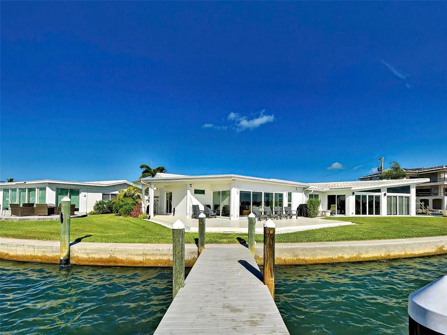 Welcome to White Cap Villas on Venice Island — where refined coastal living meets breathtaking waterfront views.
Perfectly positioned at the tip of White Cap Circle, this exceptional single-story villa captures sweeping, unobstructed panoramas of Roberts Bay, arguably among the most spectacular waterfront views on Venice Island. This thoughtfully designed home features a private primary suite complete with a full en-suite bathroom. A versatile den includes a built-in Murphy bed—perfect for a home office or hosting overnight guests—while a second full bathroom off the main living area ensures convenience and privacy. An in-unit washer and dryer are also included for your convenience. Completely reimagined and extensively renovated throughout 2024 and 2025, the residence showcases an uncompromising level of craftsmanship and design. Every detail was thoughtfully curated using premium materials sourced from around the world, including custom European-imported cabinetry, exquisite Brazilian quartzite surfaces, and elegant Turkish limestone seamlessly integrated throughout both the interior and exterior spaces. The home also features all-new infrastructure and modern systems for comfort, efficiency, and peace of mind, including a state-of-the-art inverter HVAC heat pump system, fully updated fresh and gray water plumbing, new electrical wiring and control panel, designer lighting, and hurricane-rated impact windows and doors with Low-E insulated glass. For boating enthusiasts, the private 30-foot dock sits on deep sailboat water with direct Gulf access and no bridges, offering effortless access to open water within minutes. White Cap Villas is a rare and highly sought-after waterfront enclave of 32 villas, offering a truly maintenance-free lifestyle in one of Venice Island’s most desirable locations. The association is also pet friendly and offers a heated pool, making it ideal for full-time residents or seasonal coastal retreats. Experience elevated island living at its finest.