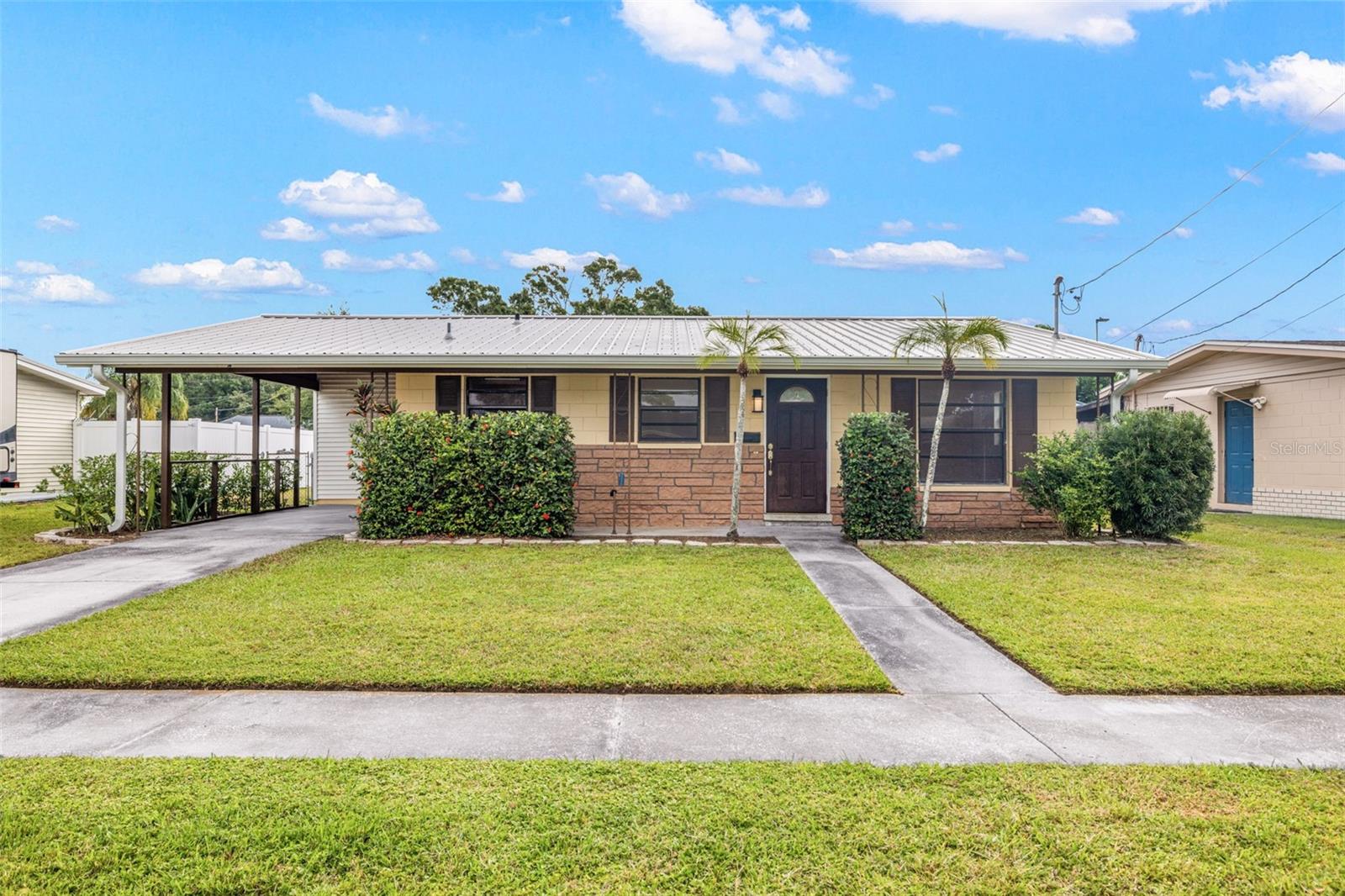 DO NOT MISS THIS PROPERTY!! Block construction property with a new metal roof (2024) and new electrical panel with house re-wire (2024). Perfect first home or rental property. The HVAC unit was updated in 2017. Terrazzo and wood floors through this 3 bed, 1 bath, single story home boasts an abundant number of closets for the size of the home. The larger single bathroom has a vinyl walk-in shower. Large fenced back yard perfect for adding a pool or creating the outdoor lifestyle that may be appreciated in Florida. The backyard currently boasts a detached shed with a metal roof perfect for storing the necessary lawn equipment for this property or could become a garden shed. This property has a driveway and attached single carport outside the side door perfect for unloading groceries. At the rear of the carport is an attached storage room that includes laundry with washer and dryer. This property is ready for your personal touches to make this house a home.