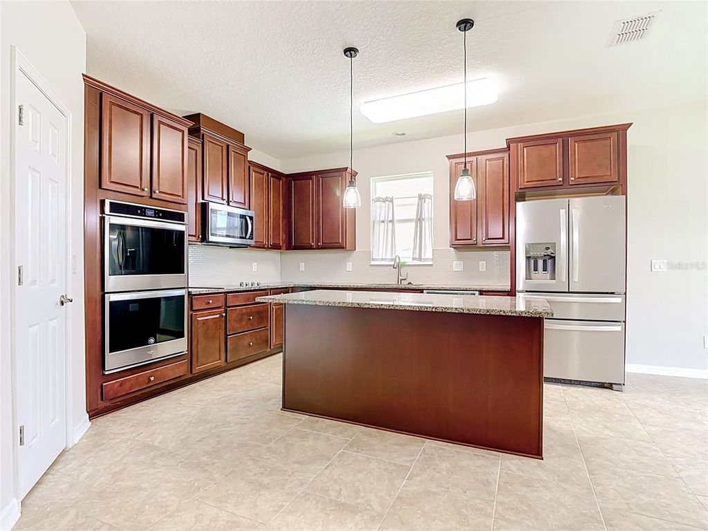 Photo of 2687 Gaspirilla Circle, Kissimmee, FL 34746 (MLS # O6419839)