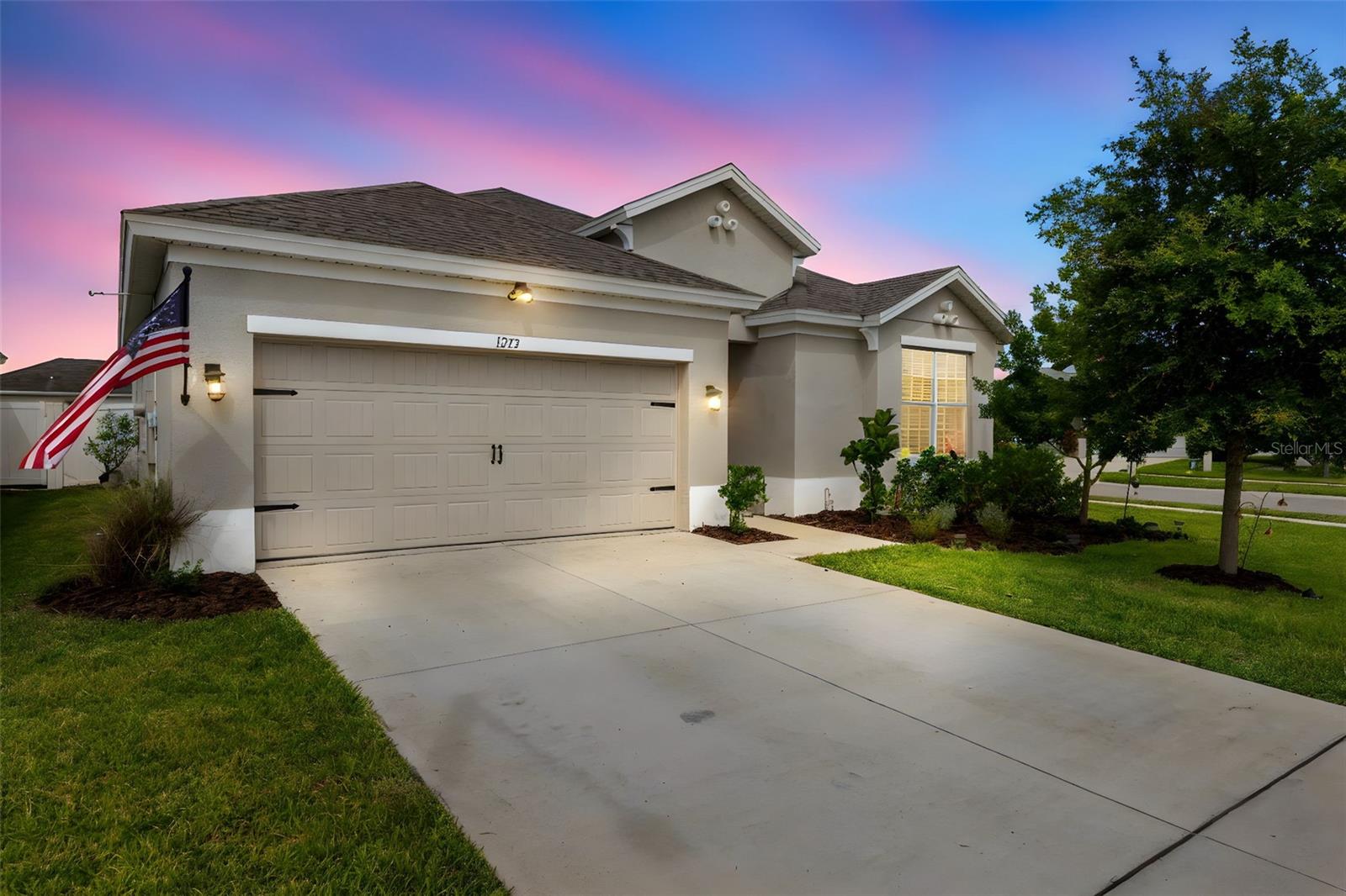 Welcome to 1275 Old Windsor, where the ambience that this home evokes just can't be put into a listing description, it must be experienced! Located on a pristine, fully fenced corner lot in Avalon, where you're less than five minutes from the expressway, the baseball complex and park with new splashpad and walking/biking distance to Publix and other shopping. The pool and other amenities are right across Oak Chase Blvd for your convenience. This FOUR YEAR NEW home offers a unique floorplan that offers flexibility and functionality with FOUR BEDROOMS plus a flex space located in the alcove among two secondary bedrooms and bathroom. THREE FULL bathrooms, one of which is nestled in the spacious front bedroom giving you a secondary suite. The storm door allows all the natural light to highlight all of the upgrades such as custom window casings, the gorgeous new luxury vinyl plank flooring that graces the whole home, except for the bathrooms. Come through the elegantly trimmed foyer space and take in the custom pendants above the 106 inch superior grade granite island, the matching stainless steel appliances and ample 42 inch cabinets, along with the large dedicated pantry the beautiful kitchen offers. This wide open floor plan allows you to take it all in, gazing into the dining area and on to the living room where a new custom electric fireplace commands the spotlight, adorned with shiplap and a beautiful hearth and mantle. The primary bedroom boasts a dressing room size closet, as well as large bathroom with dual vanities and walk in shower with upgraded tile and listello border and private water closet. Relax outside in your private backyard on your patio where plumbing has been allocated for a pool. As if all that wasn't enough, the sellers are leaving the washer and dryer for you! This home is sure to be grabbed up soon so make your appointment today!