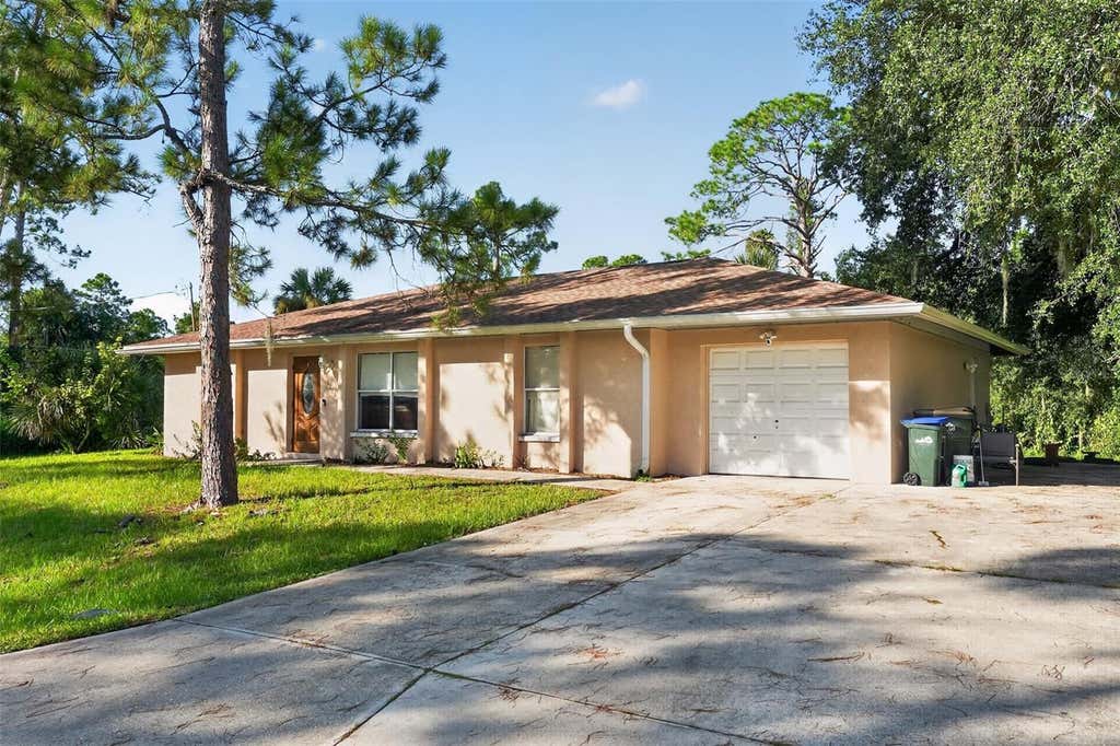 Photo of 1116 Dustin Road, North Port, FL 34288 (MLS # O6435074)