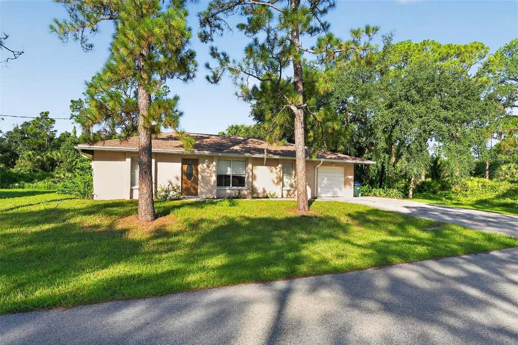 Photo of 1116 Dustin Road, North Port, FL 34288 (MLS # O6435074)