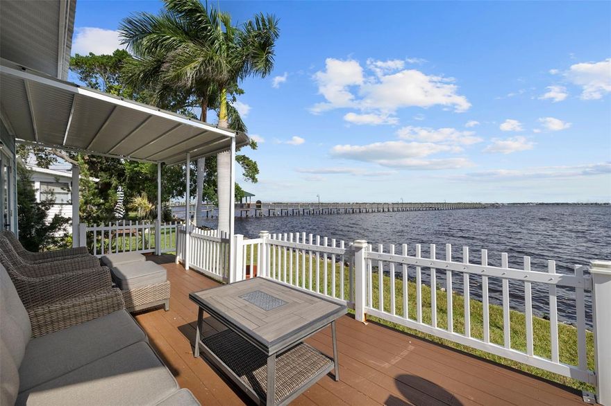 One or more photos virtually staged. Discover one of the most desirable homes in this quiet waterfront neighborhood — where modern style meets the relaxed charm of coastal Florida living. This beautifully updated home sits along the peaceful Manatee River with the opportunity for your own private boat slip — either in the water or in on-land storage — giving you direct access to the Manatee River and beyond.

Inside, the open-concept layout is bright and inviting, featuring sleek Dekton countertops, custom cabinetry, and high-end finishes throughout. Natural light fills the main living areas, creating a seamless connection to the outdoors and the tranquil water views.

The spacious primary suite offers a comfortable retreat with a private bath and soaking tub, perfect for relaxing after a nice day on the water!

Step outside to your expansive waterfront patio, ideal for entertaining, dining, or simply relaxing as boats drift by. A covered carport adds convenience and practicality, while lush tropical landscaping completes the coastal aesthetic.

Located minutes from downtown Bradenton, top-rated restaurants, and the beaches of Anna Maria Island, this home blends comfort, location, and lifestyle in one perfect package.

Enjoy the best of Florida waterfront living — schedule your private tour today!