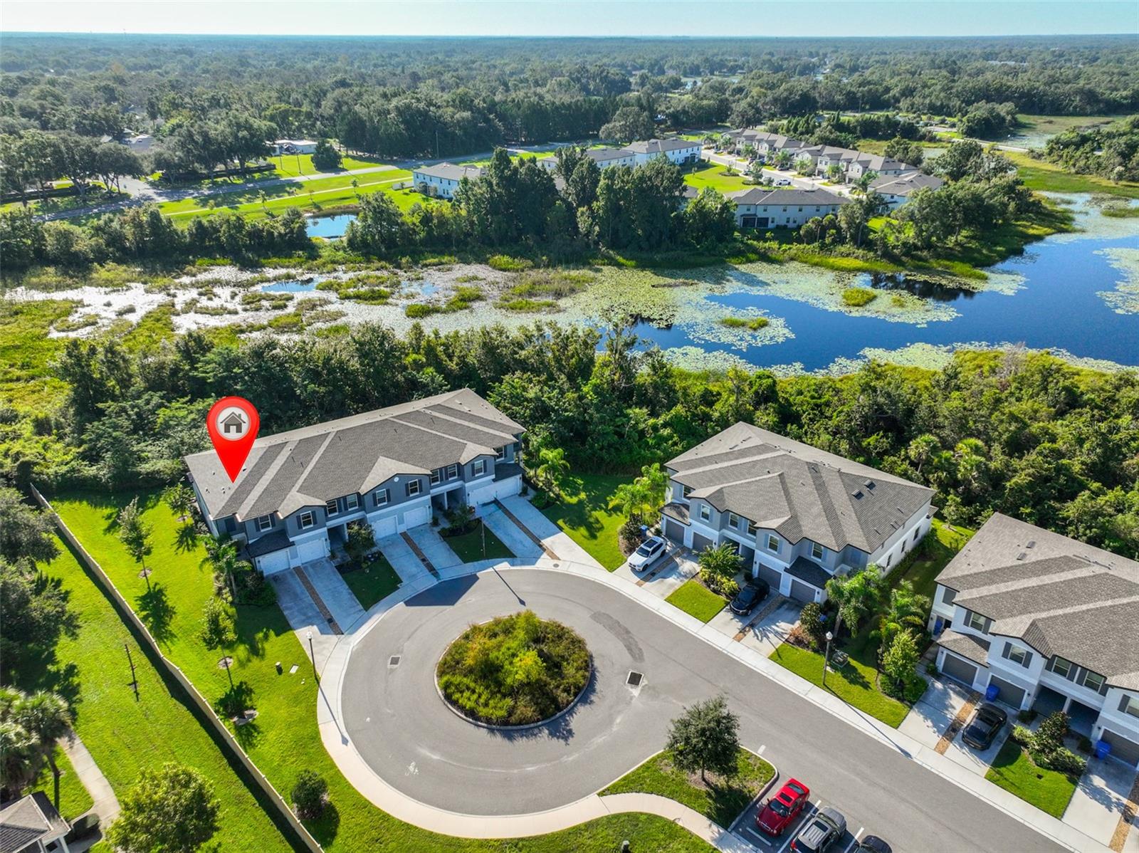 Welcome to this beautifully maintained townhome tucked away on a quiet CUL-DE-SAC in the desirable Willow Square community of Lutz. This residence offers a rare oversized driveway with plenty of parking space and gutters already installed for added peace of mind. Located on a dead-end street, the home provides extra privacy and minimal traffic, making it an ideal setting. Upon entering the front door, you will love the oversized gorgeous modern porcelain tile throughout the entire downstairs. The first floor of this two-story townhome includes an expansive Great Room with direct access to the cozy nook and well-equipped kitchen featuring white cabinetry and stainless-steel appliances. Off the kitchen is the large SCREENED IN LANAI overlooking gorgeous CONSERVATION giving you the tranquility you desire after a long day. The great room features a beautiful natural light and treelined views that only an END UNIT can offer. Upstairs, a multipurpose loft divides the lavish owner’s suite from the additional bedroom, both of which feature walk in closets and private bathrooms for convenience. The owner's suite is very spacious and has beautiful views of the conservation area and beams with natural light. The laundry room is also located upstairs and includes the washer/dryer which is an added bonus! Willow Square is a well-maintained community that offers a gated entry, resort style pool and play field. Residents will also appreciate the close proximity to TOP RATED SCHOOLS, shopping centers, dining establishments, Tampa Airport and top-rated beaches. Don't miss out on the opportunity to make this exceptional property your own. Move-in ready 2021 built townhome available now with builder transferrable WARRANTY! Why wait for new construction to be built? Schedule a viewing today!
