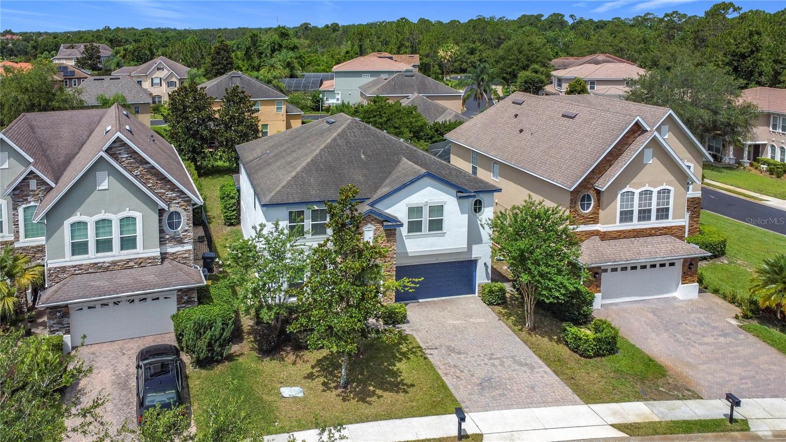 One or more photo(s) has been virtually staged. Don’t miss out on this great opportunity to live in this great community of Providence. Fresh exterior painted. This spacious 5-bedroom, 4.5-bathroom home is located in the highly sought-after gated golf community of Providence, featuring an 18-hole course designed by Michael Dasher. With 3,430 sq. ft. of living space, this home welcome the feel of a brand-new property, enhanced by numerous upgrades. Step inside to an open-concept layout with 42" kitchen cabinets, granite counter-tops, stainless steel appliances, and an oversize island with a breakfast bar perfect for entertaining. A versatile room on the main floor can be used as a formal dining area or a home office. The first floor includes a bedroom with a full bathroom inside for more convenience. Upstairs, you’ll find four spacious bedrooms, including two master suites. One features a soaking tub, walk-in shower, and double vanities; the second brings a large bathroom, and walk-in closet. A generous enclosed loft completes the second floor ideal for a game room, media room, or extra living space. A convenient laundry room also is located at the second floor. Property is conveniently located near I-4, and Disney. The Providence community amenities include resort-style pools, a fitness center, tennis courts, playground, clubhouse, and restaurant. Schedule your private showing today!