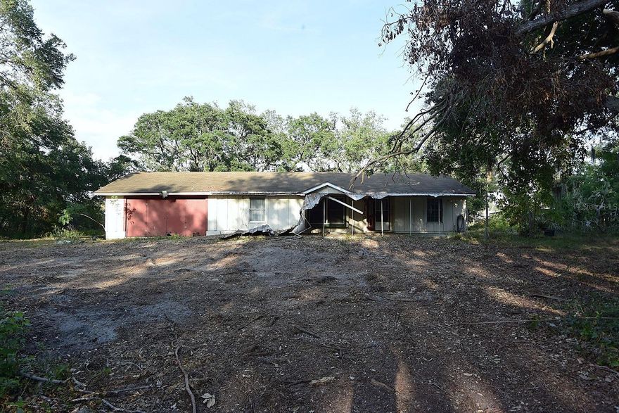 Discover 6.45 acres of opportunity on the scenic Alafia River! A recent survey reflects 4.48 acres of combined upland, providing plenty of usable land to create your dream riverfront retreat. The property includes a 1,236 sq ft wood-frame home with a 440 sq ft enclosed porch (with wall unit) and an oversized 505 sq ft two-car garage. The home does not appear to have been flooded from last year’s hurricanes. On Lot 4, there is a dilapidated singlewide mobile that will need to be removed, as it crosses the lot line and is in poor condition. Additional features include a large shed with an overhead garage door on Lot 4 for extra storage. With county review, there may be potential to obtain a variance for placement of a tiny home or small mobile. This main home on Lot 2 may also be eligible for renovation under the FEMA 50% rule, currently allowing up to $120,104 in improvements without requiring full compliance with floodplain management standards. Whether you envision a serene riverfront compound, a creative renovation project, or future development possibilities, the canvas is ready. With vision and effort, this property could become an incredible river oasis!