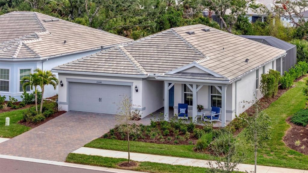 Photo of 25042 Coquina Ridge Way, Englewood, FL 34223 (MLS # A4689881)