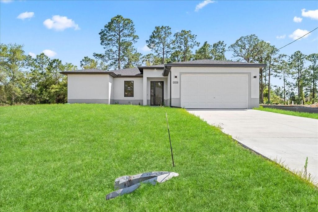 Photo of 2914 67th Street W, Lehigh Acres, FL 33971 (MLS # C7524024)