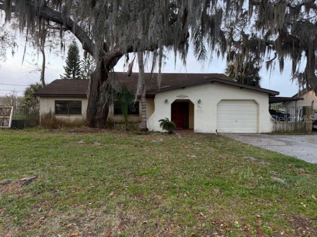 Photo of 701 Madison Street, Tavares, FL 32778 (MLS # OM721085)