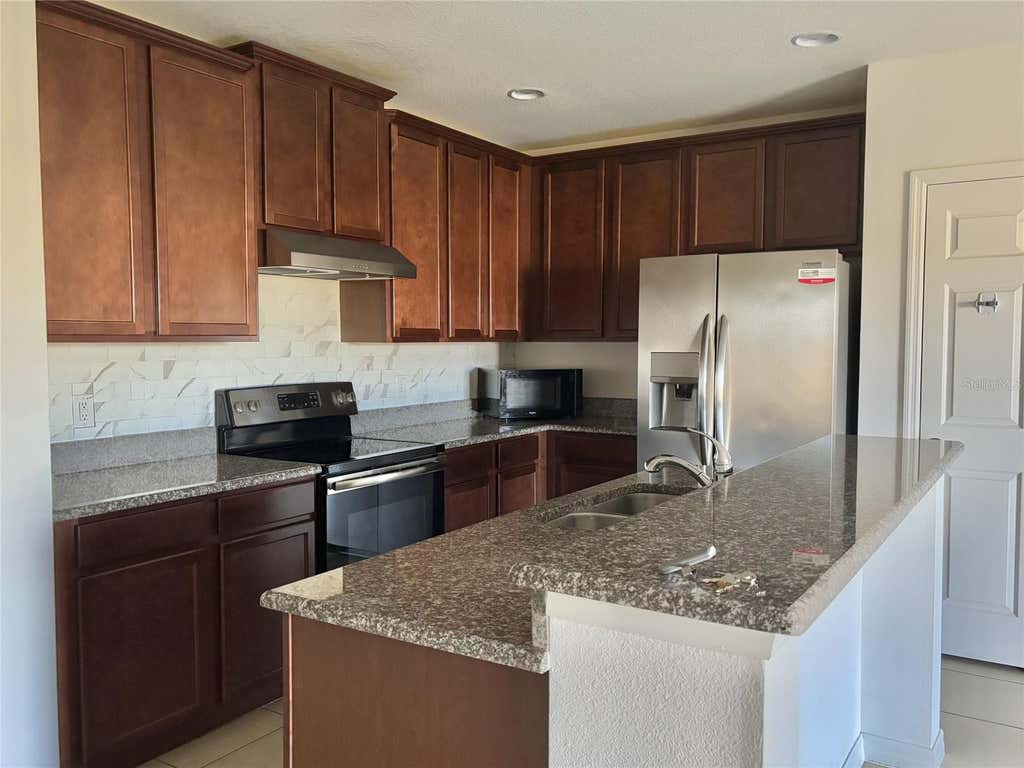 Photo of 140 Primrose Drive, Davenport, FL 33837 (MLS # S5154964)
