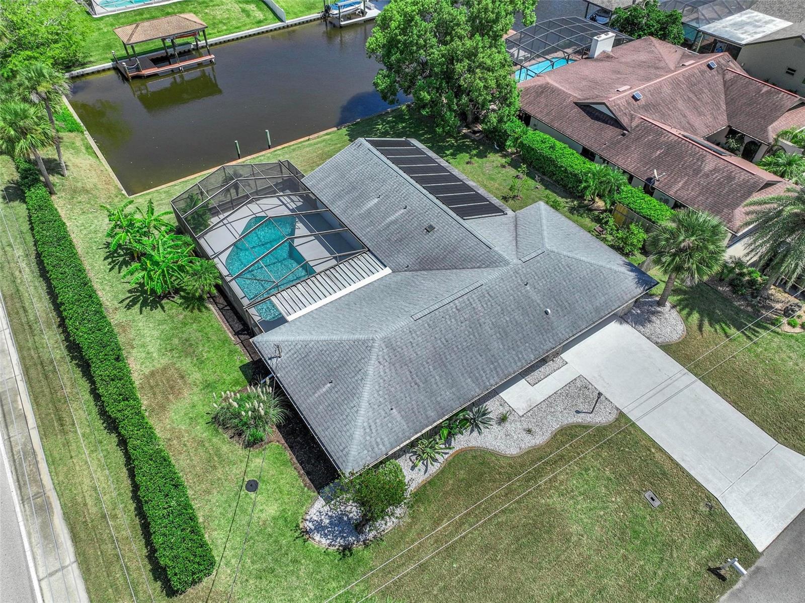 Welcome to Paradise!!! This Saltwater canal-front / Pool home; located in a peaceful cul-de-sac within the Palm Harbor community. Beautifully maintained 4-bedroom, 2-bath, 2 car garage; offers the ultimate blend of Florida lifestyle, modern comfort, and outdoor beauty. Set on an expansive .375-acre corner lot with 165 feet of water frontage, this property is a boater's dream; perfect for kayaking, fishing, or simply soaking in stunning canal views and waterfront sunsets from your backyard oasis.
Interior Features:
Split floor plan filled with natural light and seamless flow for everyday living & entertaining
Updated kitchen with 2021 Reverse Osmosis water filtration system, 2021 Instant hot water pot filler at sink, KitchenCraft soft-close cabinetry & drawers, 2022 Gas range
2023 Bosch dishwasher & stainless-steel appliances, Oversized laundry room with extra storage and functionality, Fresh interior paint (2025), Popcorn ceilings removed (2025)
Luxury vinyl plank flooring (2025), New ceiling fans & fixtures (2025)
Outdoor Oasis:
4 access points to a spacious screened lanai and pool area, Solar-heated pool (resurfaced & re-tiled in 2013) for year-round enjoyment, New pool pump & filter (2025), Roof replaced in 2019, Trane A/C unit (2022), 500-gallon propane tank (2022) with gas lines for Indoor gas stove and Future outdoor summer kitchen – ready for your grill!
Bonus Upgrades & Features:
Hurricane-proof windows (2022), Kinetico water softener system (2021), Full irrigation system with lush landscaping & mature fruit trees, Termite bond (transferable)
Plenty of outdoor space for gardening, relaxing, or expanding your backyard paradise
Location Highlights:
Just minutes from the Intracoastal Waterway by boat. Short drive to the Marina, Churches, Local parks, golf, beaches, dining, shopping & nature trails.
Whether you're searching for your forever home or a seasonal escape, 1 Claridge Court S delivers the ultimate Florida lifestyle with modern comfort, resort-style outdoor living, and priceless waterfront tranquility.
*** Seller is offering up to $10,000 towards home warranty & buyer's closing cost.
