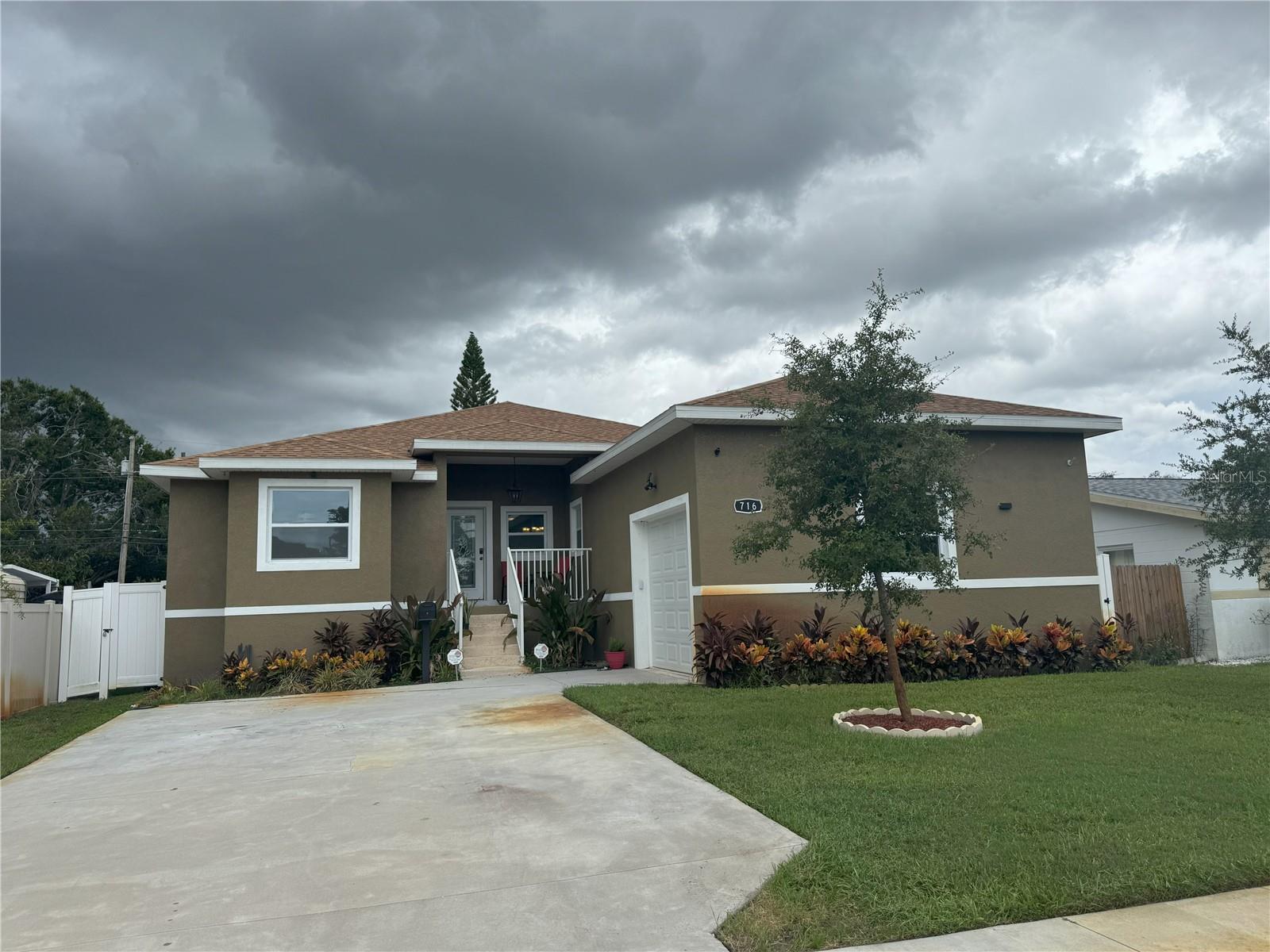 Seller is motivated and may assist with mortgage interest rate buydown. Welcome to your dream home in the heart of St. Petersburg! This beautifully maintained, newer construction residence offers the perfect blend of modern design, thoughtful layout, and a prime location just minutes away from good schools, many restaurants, beaches, international airports and major highways.
Built in 2023, this four-bedroom, three-bathroom home features vaulted and tray ceilings and an airy, open feel from the moment you walk through the door. Designed with a desirable split floor plan, the luxurious primary suite offers a peaceful retreat with a spa-like bathroom featuring a jetted tub, a shower, dual vanities with granite countertops, a private water closet for added privacy, and two oversized walk-in closets to accommodate all your wardrobe needs.
Two additional bedrooms are located on the opposite side of the home and share a beautifully appointed full bathroom, offering comfort and space for family members or guests. The fourth bedroom features an on suite bathroom and a separate entrance from the back of the house.
Plenty of cabinet and counter space is found in the kitchen. Hurricane-impact windows provide peace of mind and energy efficiency year-round. The fully fenced backyard offers privacy and space to play, garden, or simply unwind. This home is free from HOA and CDD fees. Don’t miss your chance to own this gem in St. Petersburg — schedule your showing today!