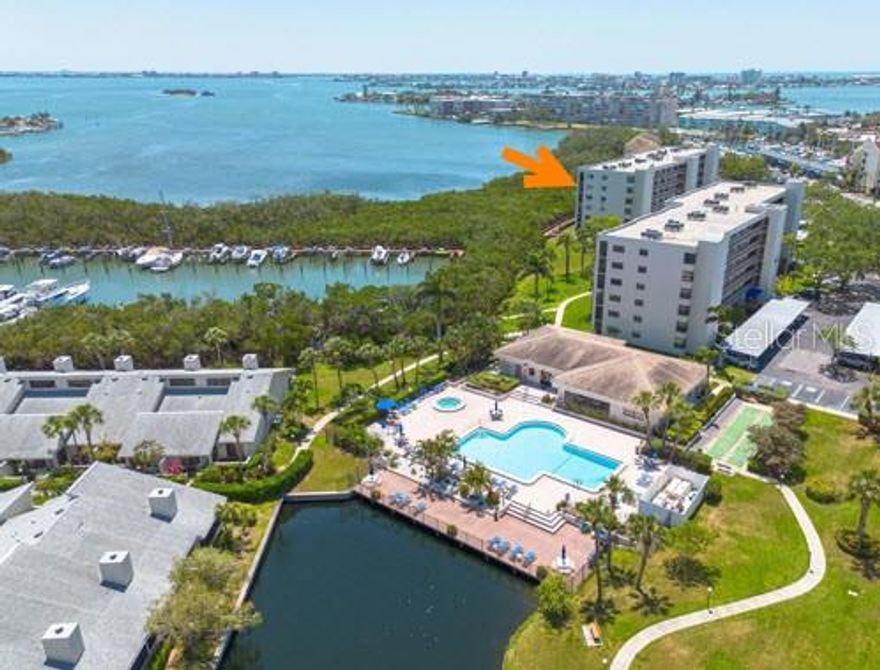 RARE 5th-floor CORNER UNIT with stunning water views in every direction — the kind of opportunity that doesn’t come along often in the highly sought-after gated community of Pasadena Cove. With wide panoramas of the marina, Boca Ciega Bay, and even Gulf of Mexico glimpses from the front walkway, this spacious 2-bedroom, 2-bath layout offers unmatched natural light and endless potential.

Inside, the home is ready for a full renovation, making it the perfect blank canvas for a buyer who wants to design their dream coastal retreat. Corner units rarely become available — especially those positioned this high — and this one delivers water views from every window, a split-bedroom layout, and a private screened balcony where you can enjoy shimmering sunrises over the bay.

Pasadena Cove is a resort-style, pet-friendly, non-age-restricted waterfront community known for its peaceful atmosphere, lush landscaping, and excellent amenities. Residents enjoy a heated pool & spa, renovated clubhouse with full kitchen and billiards, modern fitness center, shuffleboard courts, walking paths, and a scenic boardwalk to a private marina that offers boat slips for purchase or rent (when available) through the HOA — giving boaters direct access to Boca Ciega Bay and the Gulf.

Additional conveniences include in-unit laundry, a same-floor storage locker, a secure bicycle room, and deeded covered parking directly in front of the building. Milestone inspection and SIRS have been completed with no current special assessments, providing peace of mind for future owners.

Perfectly located just minutes from St. Pete Beach, Treasure Island, Gulfport, shopping, dining, medical centers, and the SunRunner transit line, this unit delivers the best of Florida coastal living — with the rare chance to transform an upper-floor corner residence into something truly extraordinary.

Bring your vision, your creativity, and your contractor — the potential here is unlimited. Schedule your private showing today and imagine the possibilities!