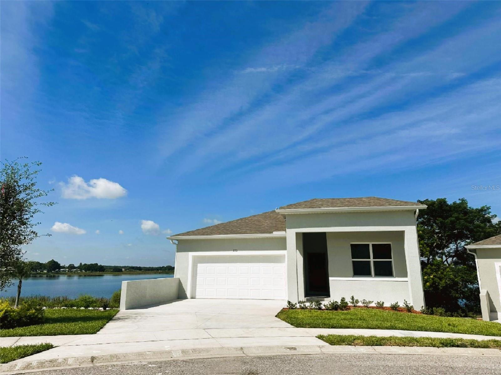Brand-New Lakefront Home – New Construction in Gated Community
Welcome to your dream home! This brand-new, never lived-in, 4-bedroom, 4-bathroom lakefront residence combines modern design, open living spaces in one of the most desirable gated communities.
As you step inside, you’ll be greeted by a spacious two-story layout designed for both comfort and style. The open-concept floor plan seamlessly connects the living room, dining area, and kitchen, creating the perfect space for gatherings with family and friends. Large windows and glass doors invite natural light throughout the home while offering breathtaking views of the lake.
The gourmet kitchen is thoughtfully designed with contemporary finishes and plenty of room for cooking and entertaining. Just off the living area, a balcony overlooks the water, providing the ideal spot for morning coffee or evening sunsets.
The luxurious master suite is a private retreat, with a spacious bathroom and a large walk-in closet. With four full bathrooms, convenience and comfort are guaranteed for all family members and guests.
On the lower level, the expansive family room opens directly to the backyard through sliding glass doors, leading to a covered patio and a summer kitchen. This space is perfect for hosting barbecues, enjoying al fresco dining, or simply relaxing while taking in the peaceful lakefront setting.
The property includes a 2-car garage.
Residents of this exclusive gated community enjoy amenities designed to enhance everyday living, including a boat ramp for easy lake access, fishing areas for outdoor recreation, a community pier perfect for relaxing and taking in the views, and the security of a gated entrance that provides peace of mind. This property also offers incredible investment potential, as it can be leased for short-term or long-term rentals, making it ideal as a vacation home. It is just 25 minutes from Walt Disney World, allowing you to enjoy the magic of Orlando while living in a peaceful lakefront setting. Don’t miss your chance to own this incredible new construction lakefront home. Schedule your private showing today!