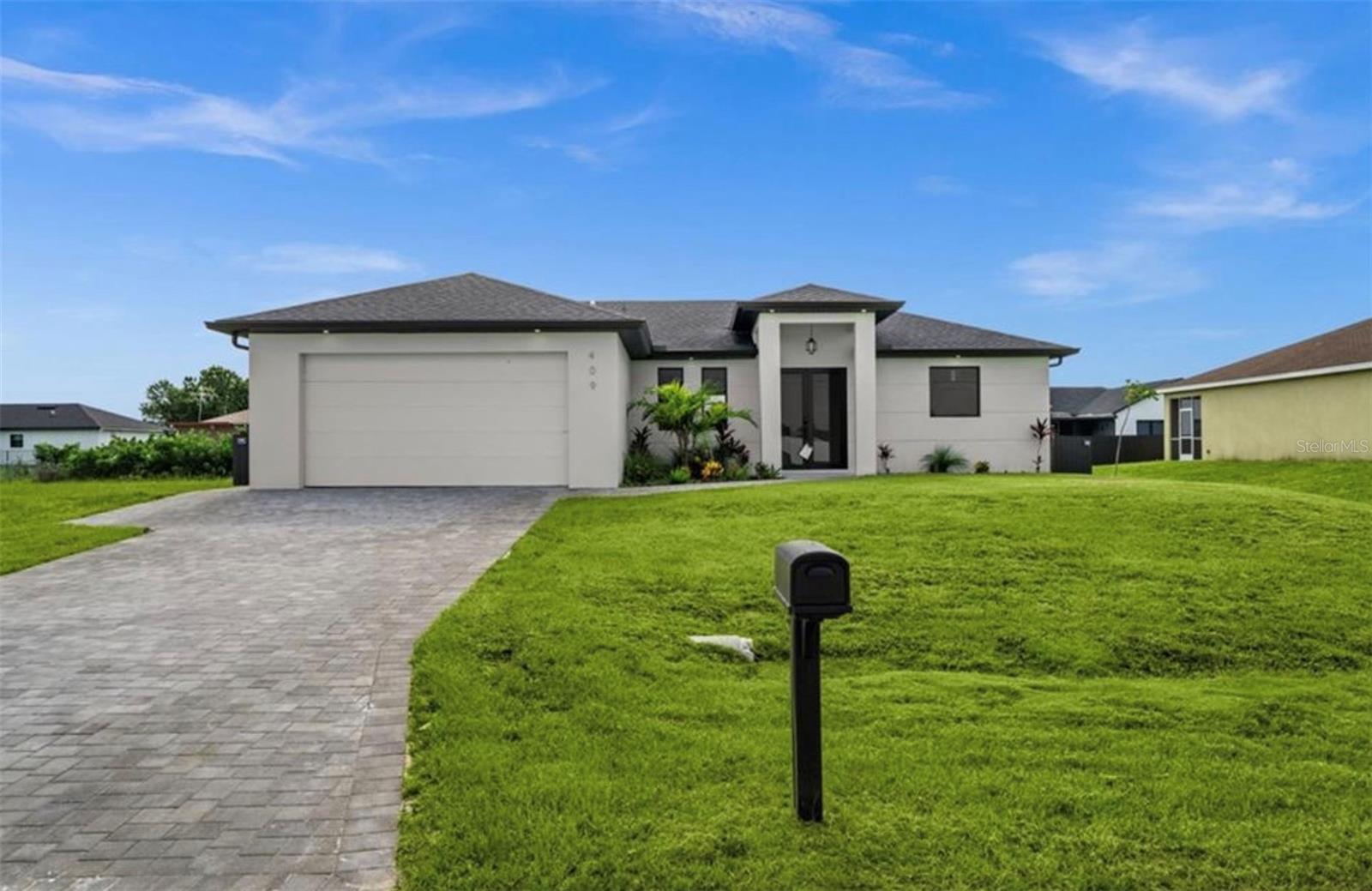Photo 1 of 77 — 409 NW 25TH PLACE, CAPE CORAL, FL 33993