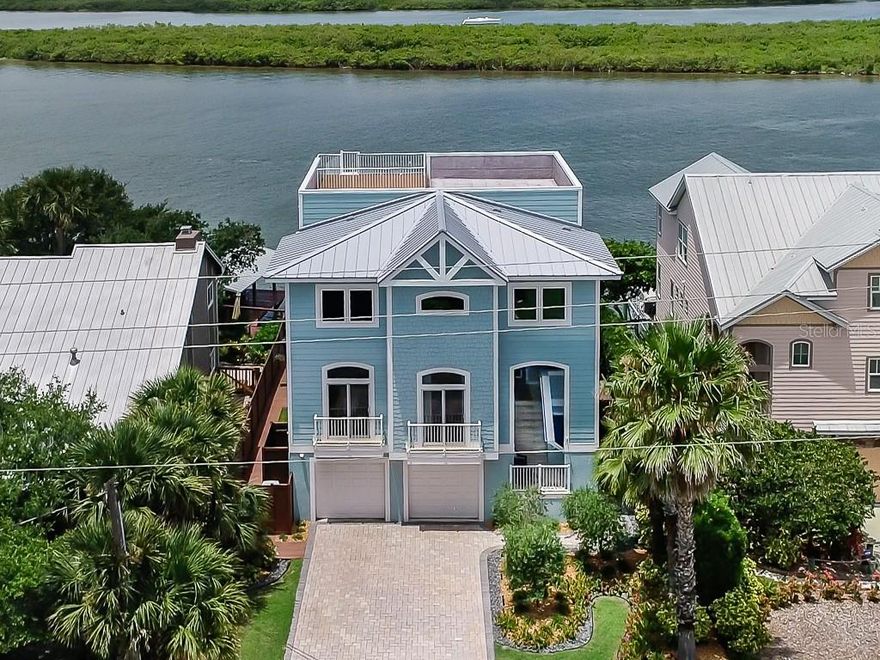 SPECTACULAR DIRECT RIVERFRONT HOME!! With Over 4100 sq. ft. of Living Area and MAGNIFICENT RIVER VIEWS, this 5 Bedroom, 4.5 Bath Home is for LIVING LARGE! Large Picture Windows and Glass Doors throughout – all high impact, Low E rated- to enjoy the view and brighten every room! Inground Heated Saltwater Pool. Boat Dock with Oversized Platform Deck and 13,000 lb. Boat Lift.  20’ Deep Water at Low Tide!!  Enjoy entertaining? No problem with this GREAT KITCHEN!  Natural gas 5-Burner Kitchen Aid cooktop, Built-in Oven and Microwave, Fisher & Paykel Dishwasher Drawers, Sub Zero Refrigerator, Viking Warming Drawer, Kraft Maid solid Hickory Cabinets, Granite Counters. Start your day with the most amazing river views from the LARGE MASTER BEDROOM (19’ X 15.5’) with 9’4” ceilings, crown moulding, wide plank Hickory engineered wood flooring, 2 walk-in closets, attached sitting room, ensuite bath with walk-in shower, jetted garden tub & two sink vanity. Private Elevator. Originally built in 2008, extensive renovation and remodel in 2015.  NEW 22kW Aluminum GENERAC Generator, NEW A/C units, 2 Rinnai Tankless Water Heaters, NEW High Impact, Low-E rated Windows and Doors, NEW Flooring, NEW Paint inside and outside, NEW Hardiboard Siding,  Heated Saltwater Pool with AZEK Premium Composite Decking, NEW Landscaping, NEW Seawall Cap and so much more…METICULOUSLY MAINTAINED AND ATTENTION TO DETAIL THROUGHOUT!!  To Fully Appreciate all that this home has to offer, schedule your private showing today! ;Water: City
