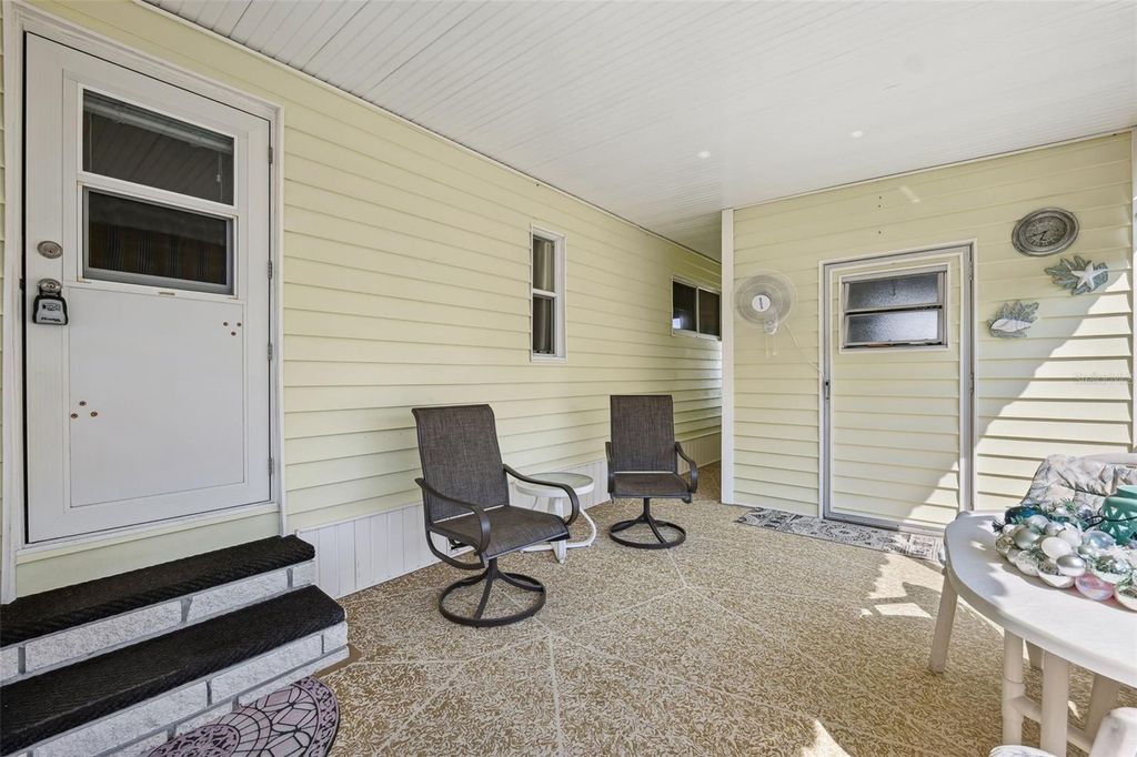 Photo of 68 Thatch Palm St E, Largo, FL 33770 (MLS # TB8444983)