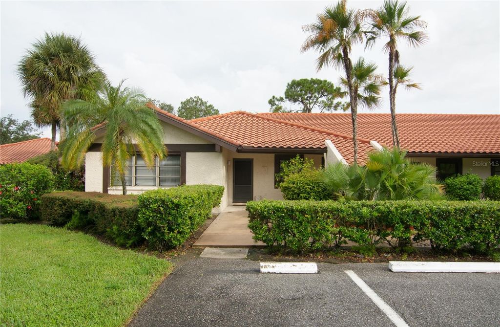 Photo of 5635 Golf Pointe Drive #101, Sarasota, FL 34243 (MLS # A4683974)