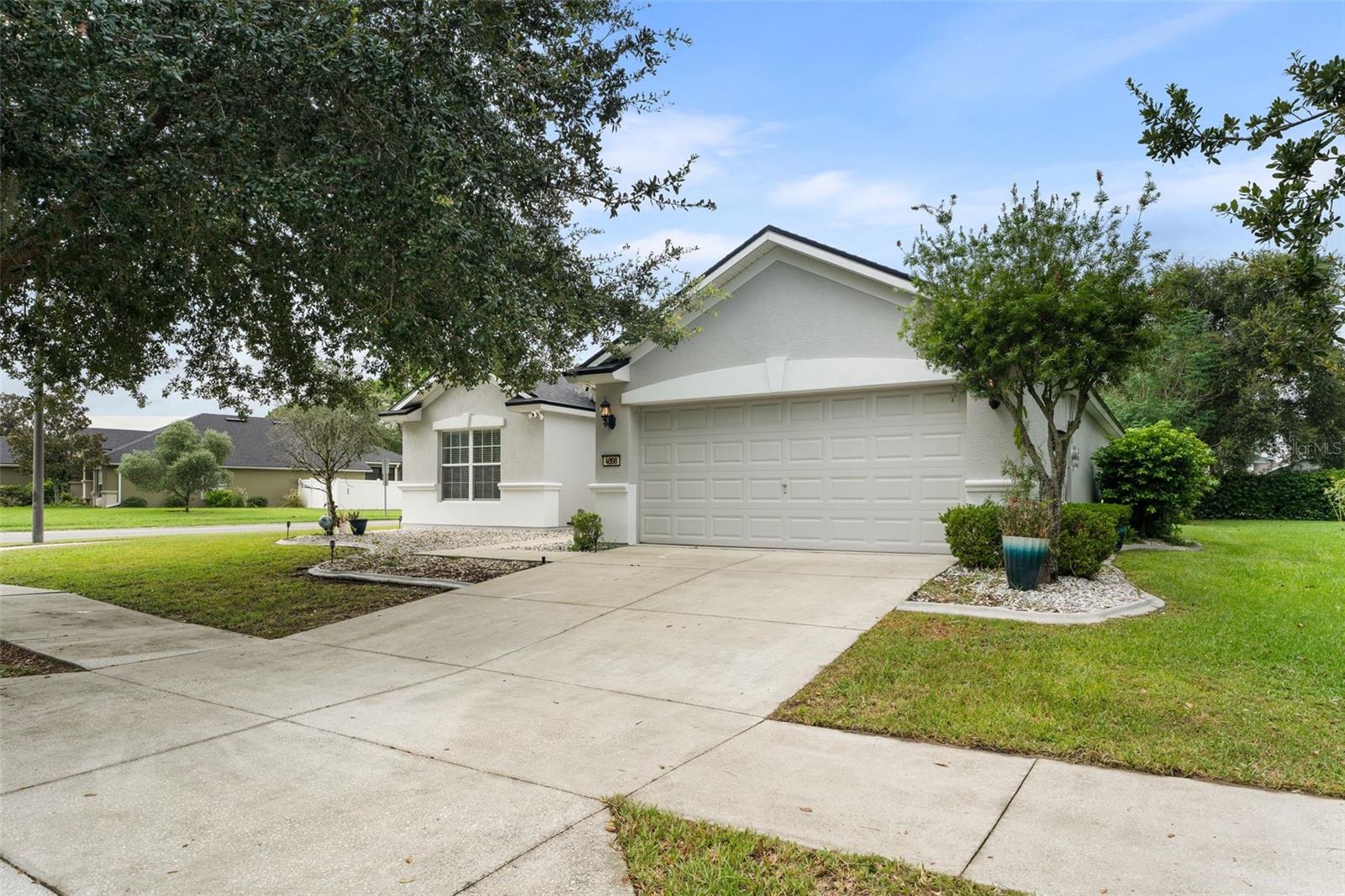 Welcome home to this immaculately kept 3-bedroom, 2-bath stucco home located in the desirable Cimarron subdivision within the well-established community of Fore Ranch. Offering the perfect blend of comfort, style, and efficiency, this turn-key property has been thoughtfully updated for worry-free living with newer roof (2022), HVAC system (2018), smart water heater (2018), a fully owned solar panel system (2018), water softener system, and automatic irrigation system.
Inside, you'll find a spacious open floorplan with soaring ceilings, updated fixtures throughout, updated luxury vinyl plank flooring, and custom built-ins topped with quartz countertops that bring both style and function to the living space. The kitchen offers ample storage, Corian countertops, and beautiful cabinetry.
The split-bedroom layout provides ideal privacy, and the primary suite features a generously sized en-suite bathroom with a walk-in shower, double vanity, separate water closet, linen closet, and a thoughtfully designed walk-in closet. Enjoy seamless indoor-outdoor living with a screened-in lanai overlooking your corner lot—perfect for entertaining or relaxing all year round.
Set in a quiet, well-maintained neighborhood with mature landscaping and sidewalks throughout, Fore Ranch offers an unmatched list of amenities, including a clubhouse, resort-style heated pool, splash park, game room, business center, fitness center, playground, basketball, tennis, and volleyball courts, soccer and football fields, and scenic walking trails. All of this is conveniently located near hospitals, shopping, dining, and top-rated schools. Don’t miss your chance to own this beautifully maintained, energy-efficient home!