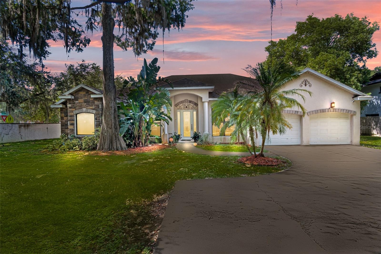 Welcome to this spacious 4 bedroom, 3 bathroom block home featuring a split floor plan and High Ceilings. This home offers a perfect blend of comfort and functionality, with a formal living room, dining room, and family room, plus an eat-in Kitchen that's perfect for family meals. Large master suite featuring a huge walk-in-closet and a spacious master bath with a garden tub and a separate shower. Very private, located on a cul-de-sac. Enjoy peace of mind with a newer roof and newer windows, along with a 2 car garage for plenty of storage. Relax with serene water views of Lake Orlando from your porch and backyard.