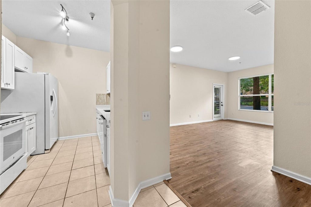 Photo of 7135 Yacht Basin Avenue #211, Orlando, FL 32835 (MLS # O6440343)