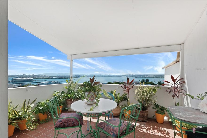 Live above the charm of Old San Juan in this bright and inviting one-bedroom apartment located on the 5th floor of a historic building with an elevator. Perched on a corner, this residence is surrounded by large windows that fill the space with abundant natural sunlight and frame stunning views of the city and San Juan Bay, where you can watch the cruise ships come and go each day. The apartment features an open and airy layout with plenty of character, offering a comfortable living area, a cozy bedroom with breathtaking city views, and a functional kitchen with modern appliances. From every room, the views and light create a relaxing, inspiring atmosphere. Residents enjoy access to a common laundry area and a private rooftop terrace reserved exclusively for the building’s residents. The rooftop offers panoramic views of the bay, city, and ocean—one of the best vantage points in Old San Juan, perfect for unwinding or entertaining. Ideally situated next to Pigeon Park, the building is just steps away from restaurants, cafés, grocery stores, pharmacies, and shops, offering the best of Old San Juan living with convenience and historic charm. This apartment is a rare opportunity to enjoy a peaceful retreat in the heart of the city, with unmatched views and timeless character.
