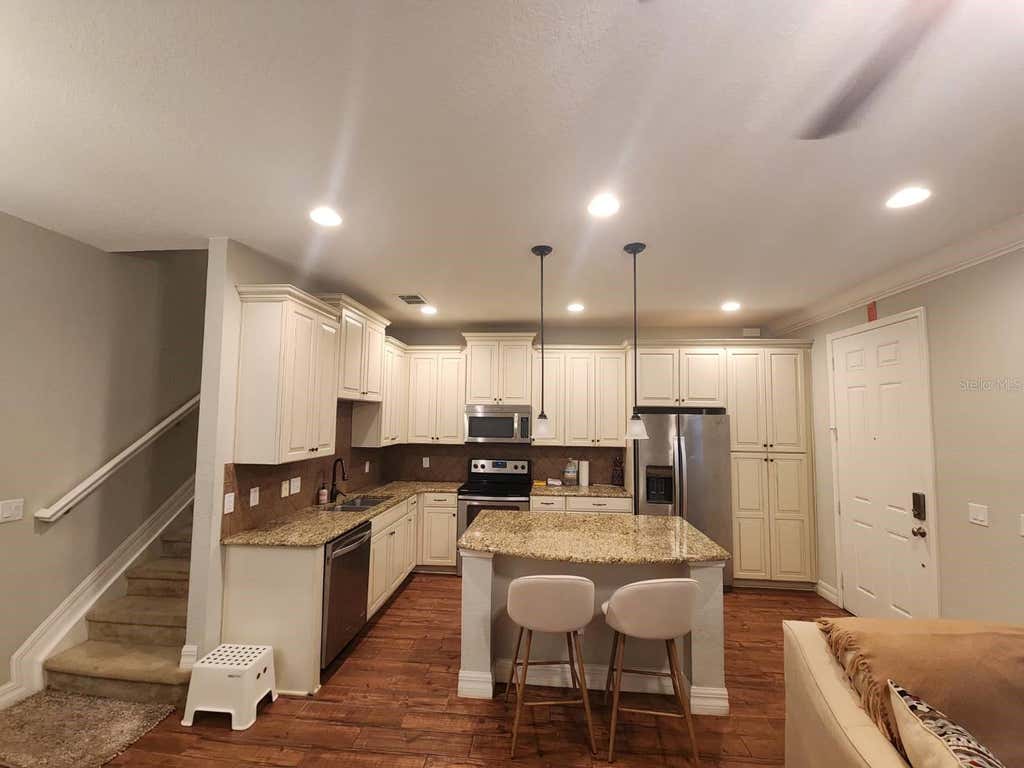 Photo of 10052 Eagle Creek Center Boulevard, Orlando, FL 32832 (MLS # O6430711)