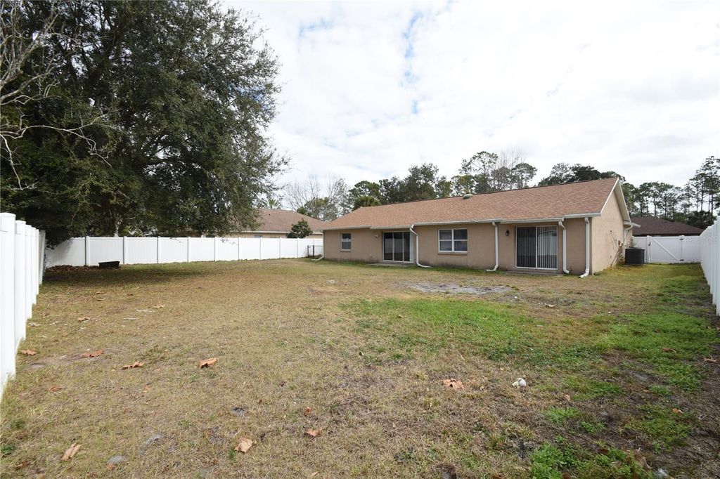 Photo of 77 Pebble Beach Drive, Palm Coast, FL 32164 (MLS # FC316188)