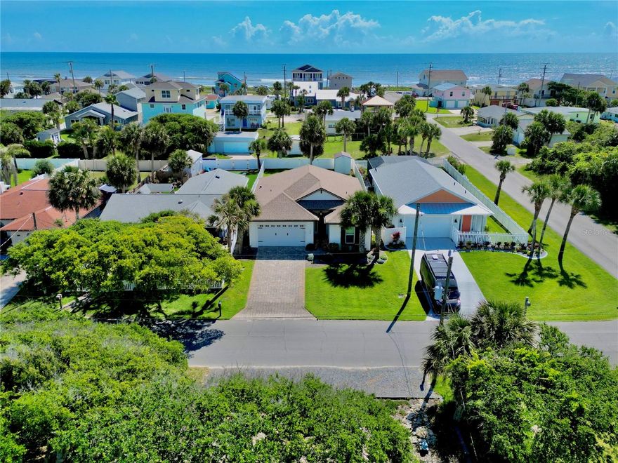 Built in 2020 and ideally located just two blocks from the ocean, this move-in ready custom 3-bedroom, 2-bath home sits on a high-and-dry lot in golf cart-friendly Flagler Beach. Enjoy a short walk to the beach along with easy access to the coastal lifestyle this area is known for.

Inside, you’ll find 10-foot ceilings, 8-foot interior doors, 6-inch baseboards, LVP flooring, tile baths, impact windows, plantation shutters, and soundproofing in the interior walls for added comfort. The beautifully designed kitchen features double-stacked cabinetry with glass uppers and lighting, granite countertops with waterfall edges, marble backsplash, propane range, convection microwave, beverage refrigerator, upgraded fixtures, and generous pantry storage with upgraded wood shelving.

The primary suite offers custom California closets, while the second bedroom includes a Murphy Bed and desk with a 25" x 80" work surface, creating the perfect flexible guest room or home office. Additional features include a whole-house on-demand generator, on-demand water heater, indoor laundry room with utility sink and Samsung washer/dryer, pull-down attic stairs with partially floored attic space, epoxy garage flooring, and an 8' garage door.

Outside, enjoy a paver driveway, full vinyl-fenced backyard with 10' gate and alley access, irrigation on a well, gutters, soffit lighting, outdoor shower with hot and cold water, 8' leaded impact front door, and an 8' x 12' storage shed with electric service. Relax on the covered patio and enjoy morning sunrises. With quality construction, coastal convenience, and a prime beachside location, this Flagler Beach home is truly a must-see.