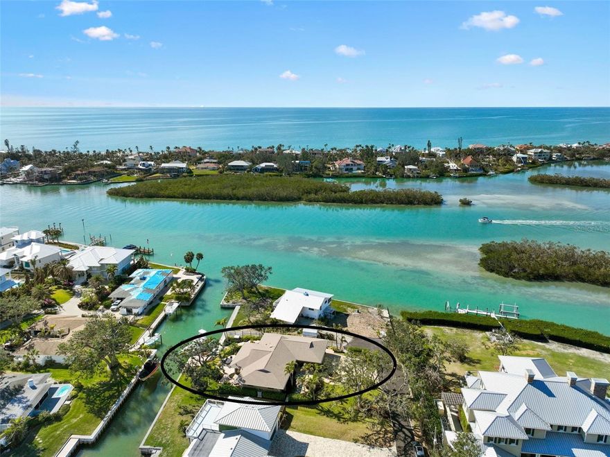 The PERFECT boating lifestyle set-up! Well-built home that sits high and dry yet close to the Jetties and Open Water! No flooding or hurricane damage. Perfectly nestled between the culturally rich Sarasota and the quaint charm of Venice, this home is your gateway to the Nokomis, Siesta Key, and Venice beaches. Here, life unfolds in a symphony of sun, sand, and sea! The No. 1 rated Pine View School is nearby. Indeed, you may indulge in every hobby you can dream of. Traverse the Legacy Biking Trail, unwind with a round of trap, skeet or sporting clays at Knights Trail Park, or get your equine fix at Fox Lea Farm. Dine and shop by golf cart along the waterfront, and embrace the home’s signature activities: sunset gazing, boating, and fishing. Step out to your boat in the back yard and be on the Gulf of America in minutes. For those who crave an unmatched waterfront existence, there's simply no comparison. This modern abode perches regally on a lot crafted for outdoor enjoyment, with professional landscaping, and terraced paver areas that invite you to bask in the glory of Florida Gulf Coast sunsets. Elegant landscape lighting casts a glow on the three mature oak trees, showcasing the home's natural allure. Step into a chef's kitchen that's a culinary dreamland, boasting a Wolf gourmet range, a Sub-Zero refrigerator-freezer, and a Bosch dishwasher. Custom-built, solid cherry cabinets with soft-close features and a walk-in butler’s pantry provide endless storage. The heart of this home is the 12-foot granite island, complete with an eat-in bar, overlooking two chef-curated vegetable and herb gardens and the soothing intracoastal waters. Large windows and sliders bathe the space in natural light, blurring the lines between indoors and out. A true split floor plan keeps the master en-suite distinct from two additional bedrooms, each boasting custom-built walk-in closets. The oversized garage, freshly coated in epoxy, is a dream for organization and storage, ideally suited for your fishing and boating gear. The dock stands ready for your catch of the day, equipped with a custom fillet table, fresh water, dock box storage, and dockside power. Don't miss your chance to experience this truly exceptional home!