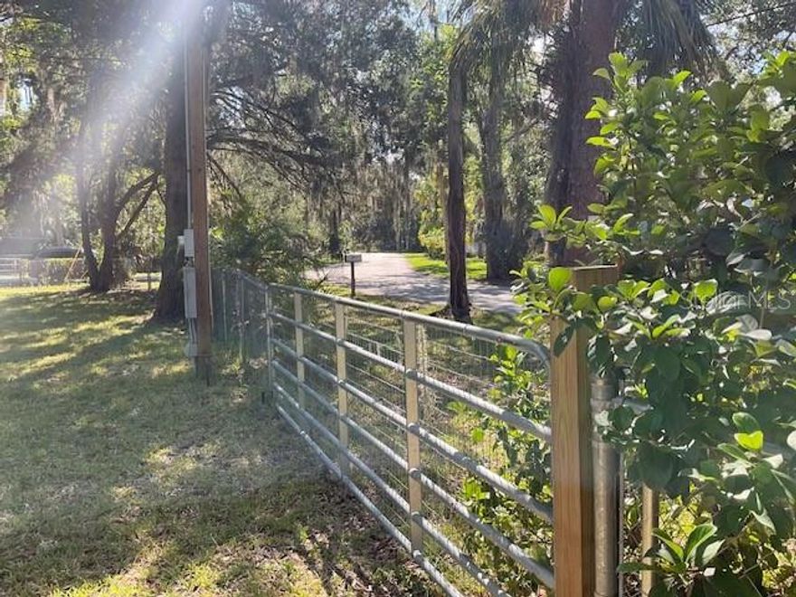 Waterfront Dreams Start Here — Camp Now, Build Later! For the Camp-Then-Build Buyer or the Investment-Minded Fisherman, this Anchor Point gem is a total catch! This corner waterfront lot is more than just a pretty view—it’s prepped and primed with electric and water already on site, and the impact fees are fully paid (huge bonus!). Enjoy 80 feet of sturdy seawall, a floating dock for your boat or jet ski, and a kayak rack that holds up to 4 kayaks—perfect for spontaneous paddling adventures. The lot is enclosed with chain link fencing, giving you added privacy and peace of mind for your RV, boat, or toys. Tucked away on peaceful Anchor Point Drive, you’re just minutes from the enchanting Weeki Wachee River, where crystal-clear waters, manatees, and mermaids await! Plus, you’ll have easy Gulf access for epic days of fishing, boating, or simply soaking up the sun. Whether you're planning to camp under the stars, fish off your dock, or break ground on your dream home, this lot checks every box. With Old Florida charm, wildlife galore, and laid-back coastal vibes, this isn’t just a piece of land—it’s your future slice of paradise. Don't let this one float away—make your move before it's gone!