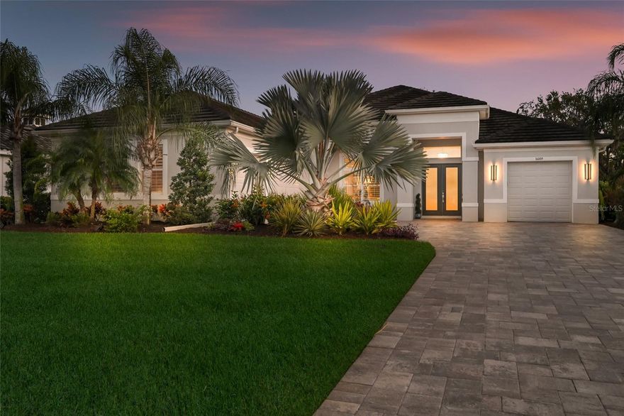 PRICE REDUCED, 4 CAR GARAGE!  TILE ROOF! MEDIA FLEX ROOM! EXTENDED OUTDOOR LIVING! 4500+ SQ FT UNDER ROOF! EXTENSIVE BUILDER UPGRADES!  $200K+ IN UPDATES!  EXPERTLY DESIGNED, DESIGNER FURNISHED OPTION TO PURCHASE!
Welcome to this exquisitely customized and designed Santa Maria Model, perfectly situated within the secure, gated boutique community of The Reserve at Twin Rivers. This luxurious four-bedroom, three-bathroom home with two primary suites and an oversized four-car garage exudes sophistication from the moment you arrive, featuring striking curb appeal enhanced by mature landscaping, a long pavered driveway, and a modern custom elevation. Step inside to discover a warm, inviting atmosphere elevated by designer finishes, including elegant crown molding, wood-look tile flooring, and no carpet throughout the home for a sleek, cohesive aesthetic. Unobstructed preserve views are visible from nearly every window, creating a constant connection to nature. The open, flowing floor plan is ideal for both relaxed living and grand entertaining, offering multiple distinct gathering spaces. The great room impresses with a custom woodwork cathedral ceiling, a statement chandelier, a floor-to-ceiling stacked stone electric fireplace, and expansive pocket sliding doors that open effortlessly to the lanai. The dedicated dining room glows with natural light beneath a custom wrought iron chandelier and flows seamlessly into the gourmet kitchen. A chef’s dream, the kitchen features a massive 13-foot quartz island with updated pendant lighting, high-end appliances including a new glass Bespoke refrigerator, induction cooktop, and double steam microwave convection oven combo, all complemented by a sleek designer touch faucet. A charming eat-in nook framed by a bay fishbowl window offers beautiful preserve views while dining.
The primary retreat is a private haven, complete with tall tray ceilings, sliding glass doors, and a picture window overlooking the sparkling pool and lush preserve. The luxurious en-suite includes two custom walk-in closets, dual vanities, a soaking tub, and a tiled walk-in shower.
A private guest wing hosts two spacious bedrooms with new top-of-the-line LVP flooring and a large shared bath, while the club/flex room at the rear of the home—with full pocket doors and a private bath—offers versatile living options and direct access to the lanai.
The true centerpiece of this home is the resort-style outdoor oasis. Three sets of pocket sliding doors create a seamless indoor-outdoor living experience. The expansive covered area features a custom-stained wood beam ceiling with dual designer fans, a full outdoor kitchen, and a sparkling saltwater pool with a new color-changing lighted waterfall. A 40-foot panoramic clear-view screen perfectly frames breathtaking views of majestic Spanish oaks and the beautifully fenced backyard, offering total privacy and tranquility.
Every detail of this home has been meticulously curated, blending luxury, comfort, and natural beauty. Conveniently located near shopping, downtown St. Pete, Lakewood Ranch Waterside, Tampa and Sarasota airports, award-winning beaches, and UTC Mall—all with no CDD fees—this property delivers an unmatched Florida lifestyle in one of the area’s most sought-after communities.