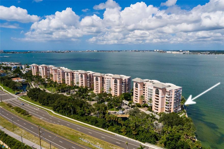 Welcome to your slice of paradise! This stunning, updated second-floor luxury condo in the outstanding gated community of Bacopa Bay is everything you’ve been dreaming of. Featuring two balconies and a reserved parking space under the building, this unique corner end unit boasts panoramic views of Boca Ciega Bay, the Intracoastal Waterway, and the beautifully landscaped Bacopa Bay grounds.

From the well-maintained corner unit, you can watch boats cruising through the Intracoastal Waterway from your side floor-to-ceiling impact windows and both balconies. The condo is packed with quality upgrades: both balcony decks were fully resurfaced in 2024, high-impact double-pane hurricane windows and sliders were installed in 2023, hurricane shutters on the large back balcony were added in 2023, and 24x24 porcelain tile was laid throughout the unit in 2019. A 3.5-ton Trane AC/heat system and water heater were installed in 2019, and there’s crown molding throughout the unit.

The condo features an office with built-in shelves and a desk, which could also serve as a third bedroom, with access to the front balcony. The family room, located just off the front balcony, has built-in shelving and a floor-to-ceiling impact window. The kitchen is equipped with granite counters, an island with a breakfast bar, and a floor-to-ceiling impact bay window in the dinette area, offering lovely views of the Intracoastal Waterway. The primary bedroom, with access to the back balcony, has views of Boca Ciega Bay, a floor-to-ceiling impact window, a large walk-in closet, and an en-suite bathroom with a double vanity, garden tub, and separate shower. The second bedroom features an impact window with views of the large front terrace, and all closets have custom shelving. You’ll only have one neighbor sharing the front terrace with you.

Bacopa Bay is known for its high-quality construction by JMC Communities, a renowned luxury builder in Pinellas County. Once you pass through the 24-hour guard gate, you’ll feel like you’ve entered a tropical oasis. Stroll along the winding paths in the community, enjoying the high-end landscaping and ponds. The Bacopa Bay Association has completed the Milestone Report with no outstanding assessments.

Community upgrades include new roofs, elevators, a concrete seawall, two resurfaced Har-Tru clay tennis courts, and two recently renovated heated waterfront pools (one a 25-meter lap pool) and a jetted spa with outside bath access. The streets have been recently paved. Additional amenities include a clubhouse with a fitness center, an onsite management office, a social and game room, a library, and a kitchen. There’s also a car wash and an EV charging station. You can have up to two pets, weighing no more than a total of 30 lbs. The building’s secure lobbies are currently being renovated and will feature keyless entry, with all lobbies linked to the guard gate.

Enjoy resort-style living just down the street from St. Pete Beach and Ft. Desoto Park. This is truly your place in paradise!