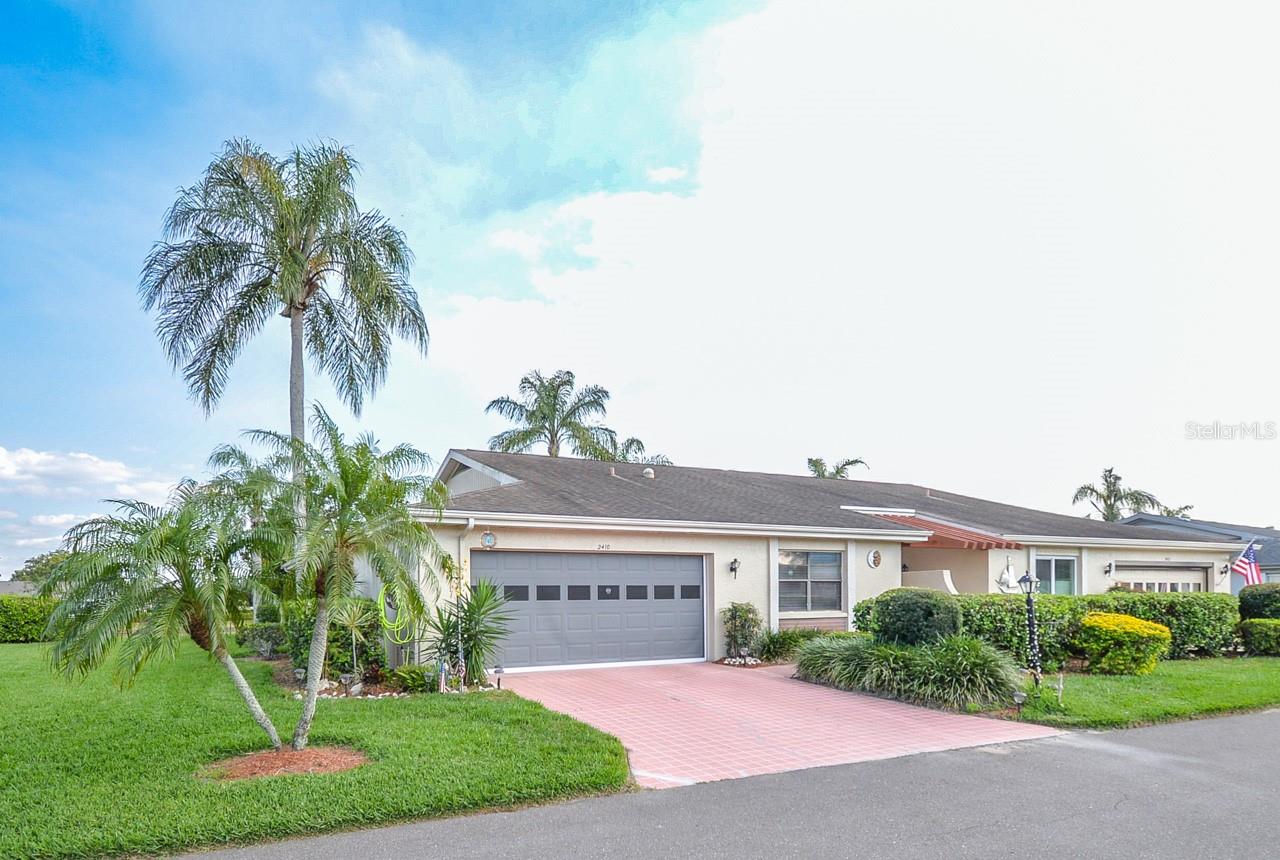 This home has a brand new roof 2025. MOVE IN READY! Embrace sunny mornings and stunning sunsets from the comfort of this condominium, featuring mesmerizing water views. Welcome Home to Gated Kings Point! Maintenance-free living in Sun City Center includes all Community Amenities. This home is in the beautifully landscaped area of Lancaster Association. A 2-car epoxy floor garage with a screened front door, 2-bedroom, 2 bath home features a Florida room (motorized sun shades) and split bedroom floor plan. ***Complete repipe, A/C 2023, Water Softener, Water Heater 2023, Dishwasher 2023, and Kitchen cabinets resurfaced 2024. This is Florida living at its best! The bright and cheery Great Room with wood flooring and perfect. The open floor plan boasts ceilings adorned with custom moldings and arched openings, creating an elegant ambiance. The kitchen is designed for efficiency, offering over-sized cabinets, new appliances, and a pantry for all your culinary needs. The granite sink and countertop feature a raised second level, perfect for setting up a buffet or accommodating bar stools for casual dining. Privacy for guests is ensured with the thoughtful split bedroom layout. Ample storage space is available in the two-car garage, equipped with surrounding cabinets for your organizational convenience. Outside yard maintenance is included, and a KPW Home Warranty is available, granting you more time to fully immerse yourself in the luxurious Kings Point Resort lifestyle, which offers an array of unbelievable amenities! Experience the best of waterfront living and resort-style indulgence in this captivating condominium. Don't miss out on the opportunity to make this dreamy retreat yours.***The condo fee includes water, sewer, cable tv, internet, pest control, exterior paint, exterior maintenance, lawncare, reserves for roof and outside painting, condo insurance exterior. Electric separate. **There is a transfer fee of $150 to Kings Point Federation and also $100 to Lancaster Condo Association to be made 10 days prior to close with association application. All real estate agents must provide a copy of their RE license at the gate.