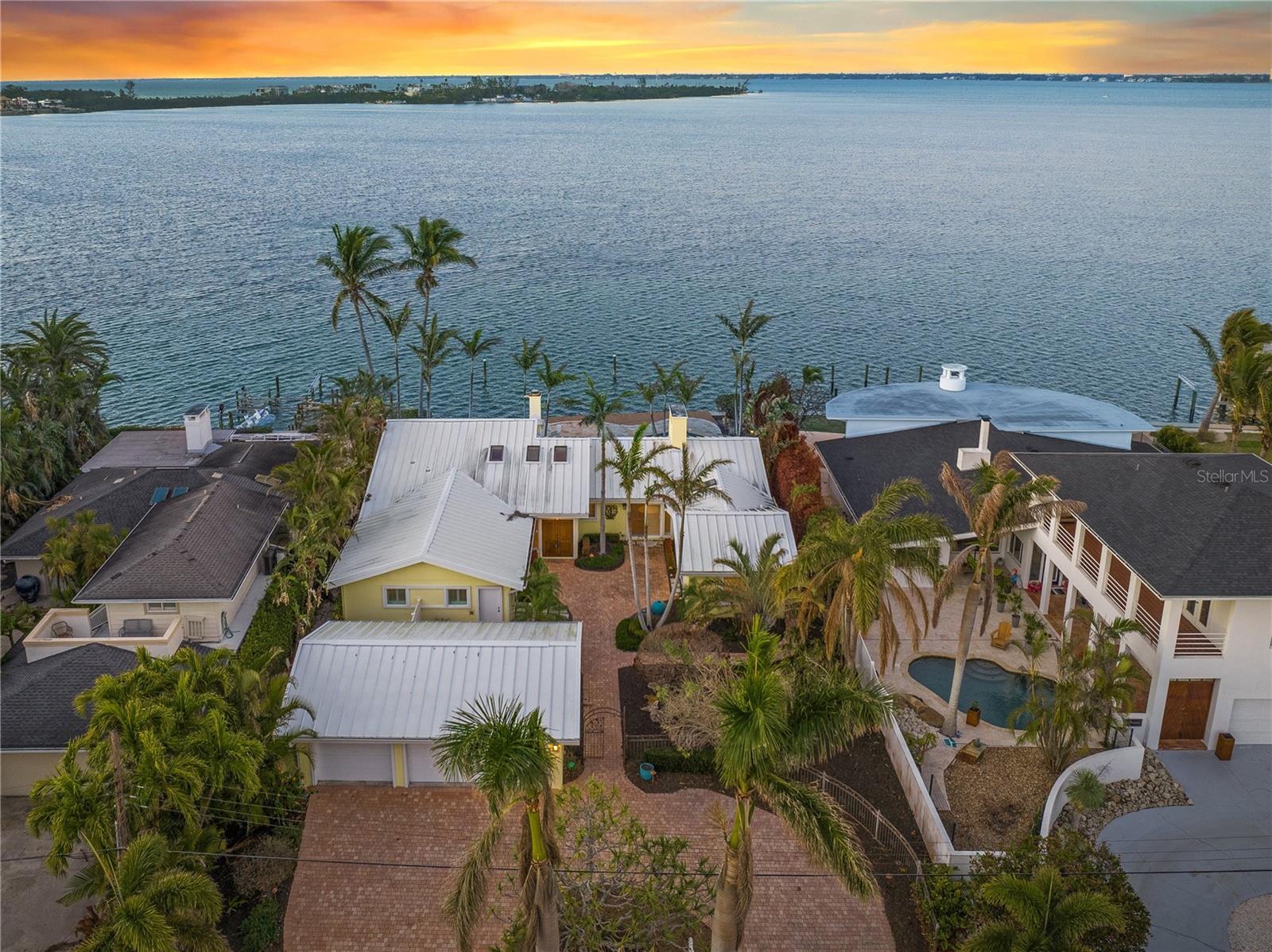 Welcome to 204 N Washington Dr, a unique property situated on 82 feet off direct bayfront. This charming home offers panoramic vistas of downtown Sarasota and the serene waters of the bay as well as having a front-row seat to playful dolphins, graceful manatees, and vibrant birdlife. A true boater’s paradise, the property offers easy access to the open waters via New Pass, or you can leisurely explore the winding waterways that define Sarasota’s coastal beauty. Originally built in 1957 and thoughtfully expanded in 1991, the home exudes timeless charm and character, featuring a perfect blend of classic appeal and modern convenience. Whether you decide to enjoy the inviting residence as-is or seize the opportunity to build your own dream home on this 13,136 Sq. Ft. lot. This property represents a rare offering in one of Sarasota’s most sought-after neighborhoods. Just a short stroll to the vibrant St. Armands Circle, Lido Beach, and minutes from downtown Sarasota, this is a once-in-a-lifetime opportunity to own a piece of Sarasota’s finest waterfront living.