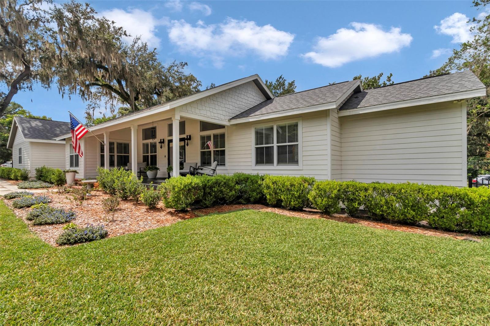 This spectacular home, originally built in 2006 and fully remodeled inside and out, is the perfect blend of timeless style, modern upgrades, and historic charm. From the moment you arrive, the welcoming Old Florida–style front porch invites you to slow down and enjoy the neighborhood’s character. Nestled within the city limits and surrounded by historic homes, the property offers both the comfort of a like-new residence and the appeal of an established, walkable community.
Inside, no detail has been overlooked. In 2023, the home underwent a top-to-bottom interior remodel featuring all-new real hardwood floors, fresh interior paint, new baseboards, and upgraded lighting and ceiling fans. Both bathrooms were transformed with new tile, vanities, sinks, countertops, and mirrors, while the laundry room was enhanced with a charming barn door that adds to the farmhouse-inspired feel.
The heart of the home is the stunning kitchen, designed with both function and style in mind. Completely remodeled, it showcases new 42 inch cabinets with convenient pullout shelves, sleek countertops, updated sinks and faucets, under-cabinet lighting, a gorgeous backsplash, and premium Bosch appliances—including dishwasher, oven, and microwave. Granite countertops and custom woodworking throughout the home add warmth and character, giving every room a polished, welcoming feel.
Major system updates ensure peace of mind as well: a new roof, AC unit, and hot water heater were installed in 2021, followed by fresh sod, a new metal fence, and professionally designed landscaping in 2022. Outdoors, front and back decks provide the perfect spaces for entertaining or simply relaxing while overlooking the cozy pool. A backyard shed adds extra storage, making the property as practical as it is beautiful.
The home’s location is just as impressive as its features. Set within Ocala’s historic district, it is only a short walk to the vibrant downtown square and just a couple of blocks from the golf cart path, offering convenient access to shopping, dining, and community events. It’s also within walking distance to the newly opened Midtown Station—Ocala’s premier food and beverage hub overlooking scenic Tuscawilla Park. Midtown Station, housed in the restored Ocala Fire & Rescue station, features local favorites like Infinite Ale Works, Sipping Ground Coffee, La Pinza, Chicken Spit, and Spagato Gelato. The hub offers outdoor dining with waterfront views, unique desserts, and live entertainment on Friday and Saturday nights, all just steps from your door.
Every inch of this property has been meticulously upgraded and lovingly cared for, making it truly move-in ready. From its welcoming Old Florida porch and farmhouse-inspired interiors to its unbeatable location near historic downtown and Tuscawilla Park, this home offers not just a place to live, but an exceptional lifestyle filled with charm, convenience, and community.