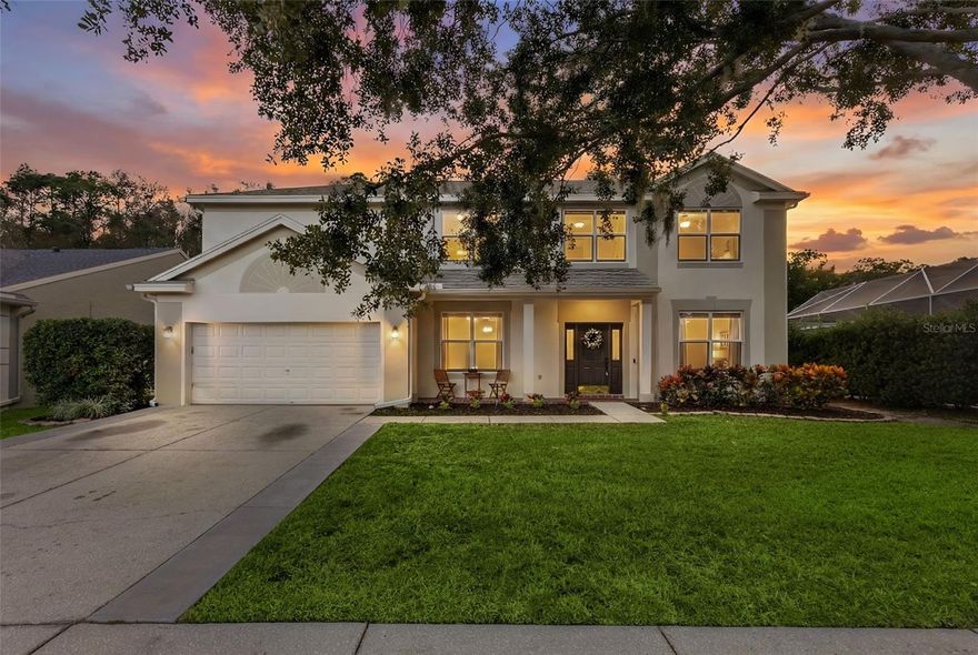 Welcome to 4242 Ellinwood Blvd., where everyday living feels like a retreat. Set on a .41-acre conservation lot, this beautifully renovated 5-bedroom, 3-bath home offers the privacy, comfort, and modern style that elevates your Florida lifestyle.   The heart of the home is the thoughtfully designed downstairs, offering plenty of space for everyone to gather—whether together or in their own cozy corners. Enjoy a breakfast bar, a formal dining area, and two separate living spaces that make everyday living flexible and comfortable. The kitchen features all-new, energy-efficient appliances—including a drawer microwave—and an abundance of storage that makes cooking and entertaining both efficient and effortless.  A flexible downstairs bedroom or study with an adjacent pool bath adds ideal convenience for guests or work-from-home needs.  Slide open the triple impact doors and step into your own outdoor sanctuary—complete with a sparkling pool, relaxing spa, and covered lanai overlooking tranquil conservation views.  Upstairs, you’ll find the beautifully updated primary suite along with four additional bedrooms, designed to accommodate a variety of living needs with ease. The amount of storage on this level is truly impressive—starting with a massive walk-in closet in the primary suite and an additional “store-anything” closet that’s nearly as large. The updated primary bathroom features a relaxing soaking tub, a separate shower, and generous counter space and cabinetry. It’s a retreat that makes every day feel like a stay at a luxury hotel. Living in Lansbrook means more than a home—it’s a lifestyle. Enjoy Lake Tarpon access from Lansbrook’s private dock, lakefront parks, scenic walking paths, sports courts, playgrounds, and quick access to Publix, dining, beaches, and Tampa International Airport. Roof 2018, Dual HVAC 2018 & 2024