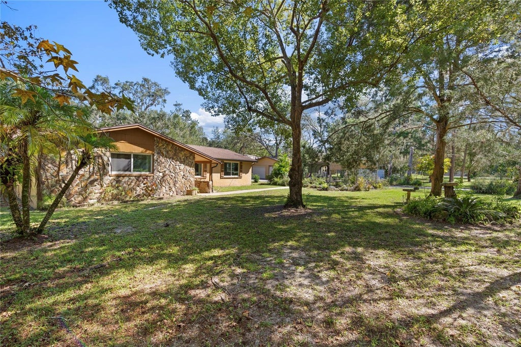 Photo of 10179 Frierson Lake Drive, Hudson, FL 34669 (MLS # TB8557891)